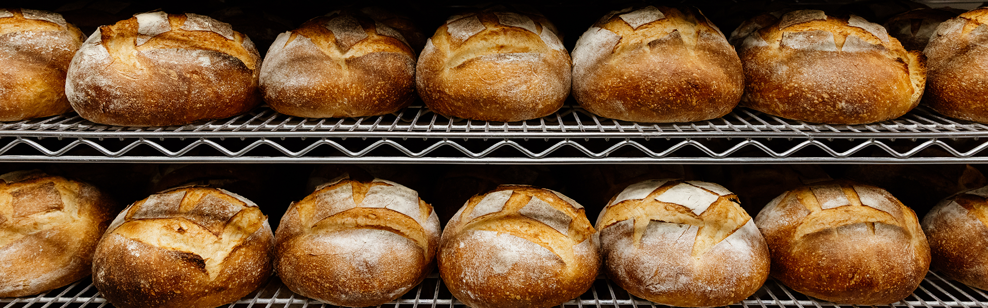 Fresh Easy Tiger bread loaves on bakery racks