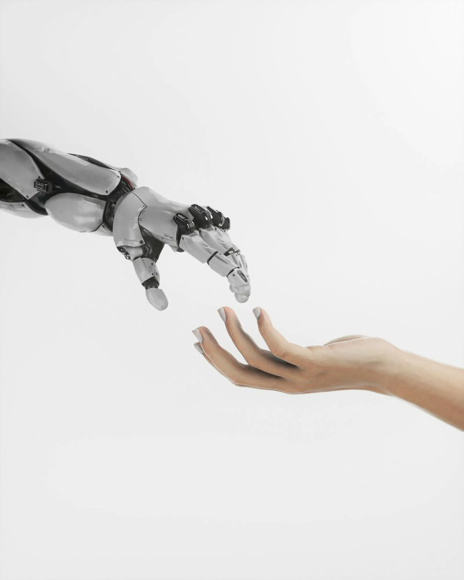 Robotic and human hand almost touching, symbolizing connection between technology