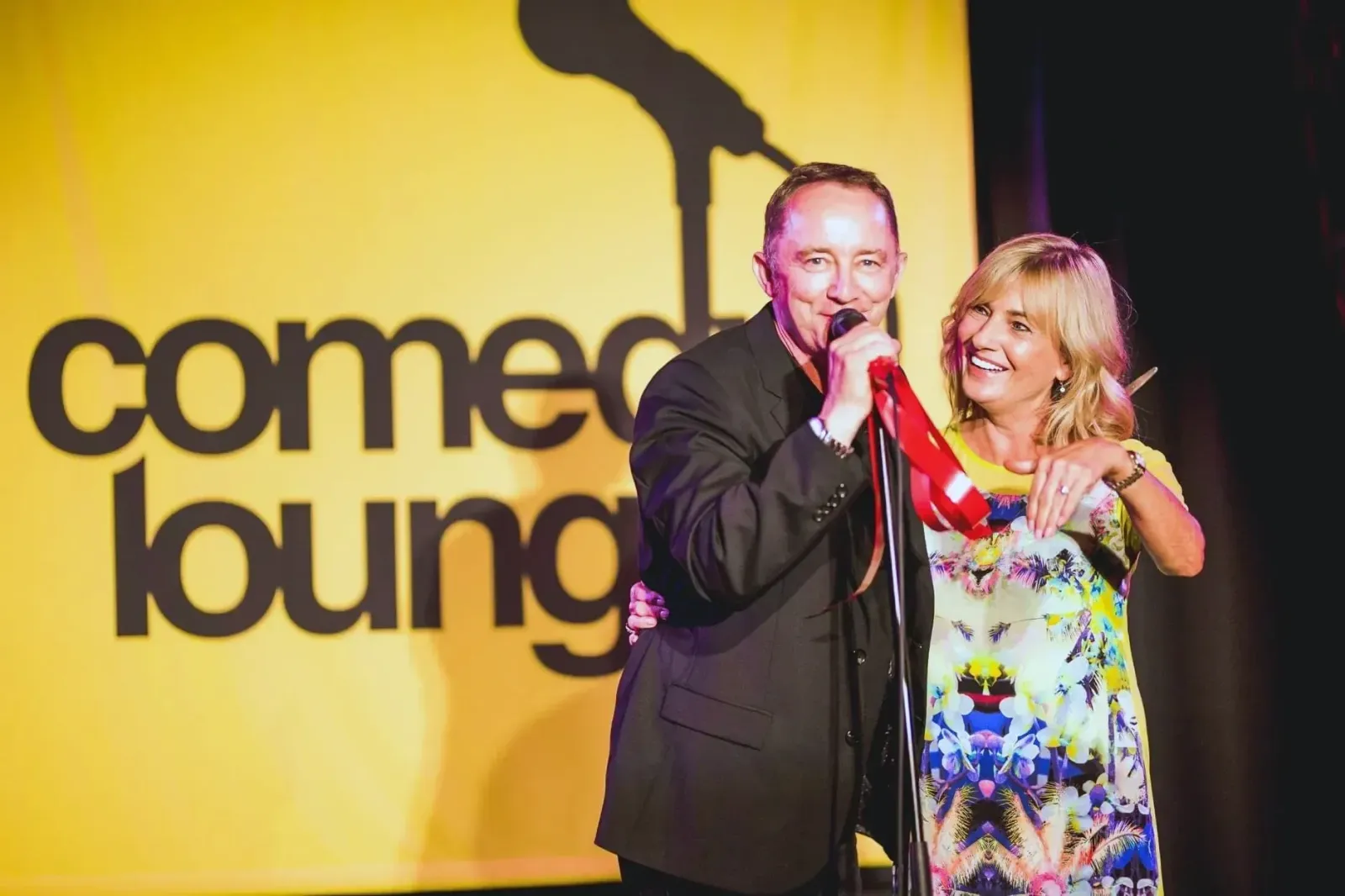 owners Jane and John McAllister on stage for the grand opening of Comedy Lounge in Western Australia