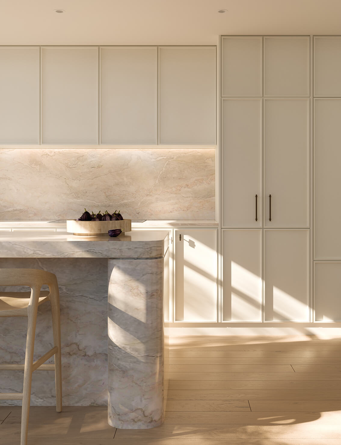 Modern kitchen with a marble island, wooden stool, and minimalist cabinetry, illuminated by soft natural light.