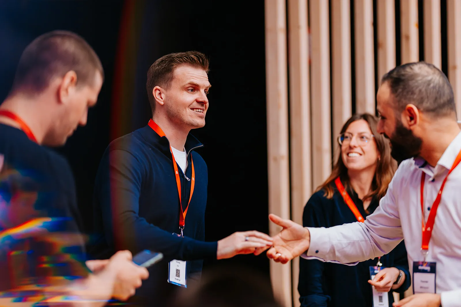People shaking hands at SuperNova 2025