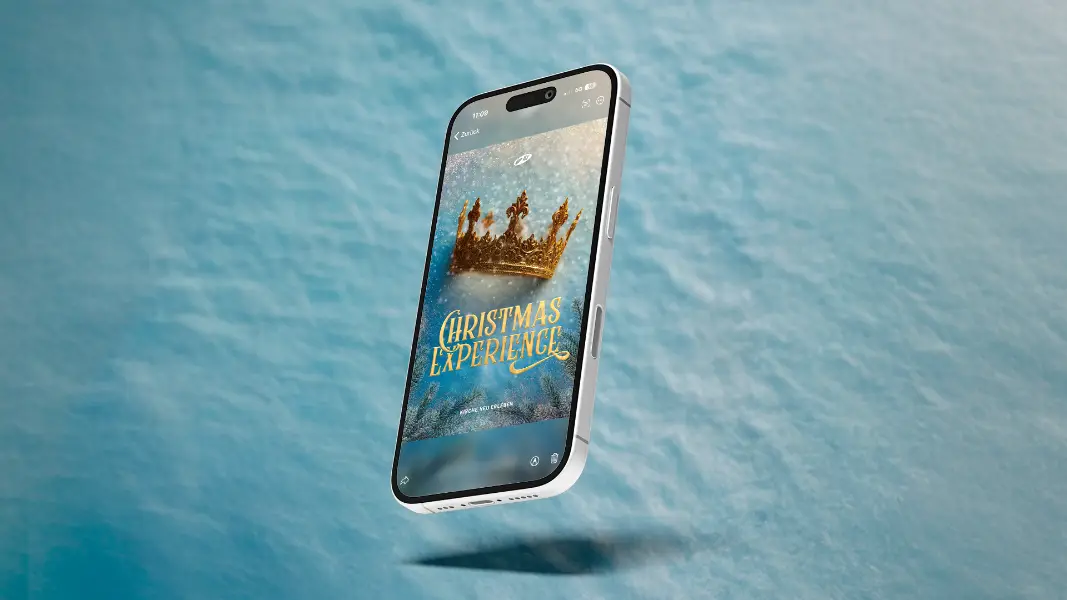 „Christmas Experience“-Flyer auf einem iPhone, das den Event digital bewirbt