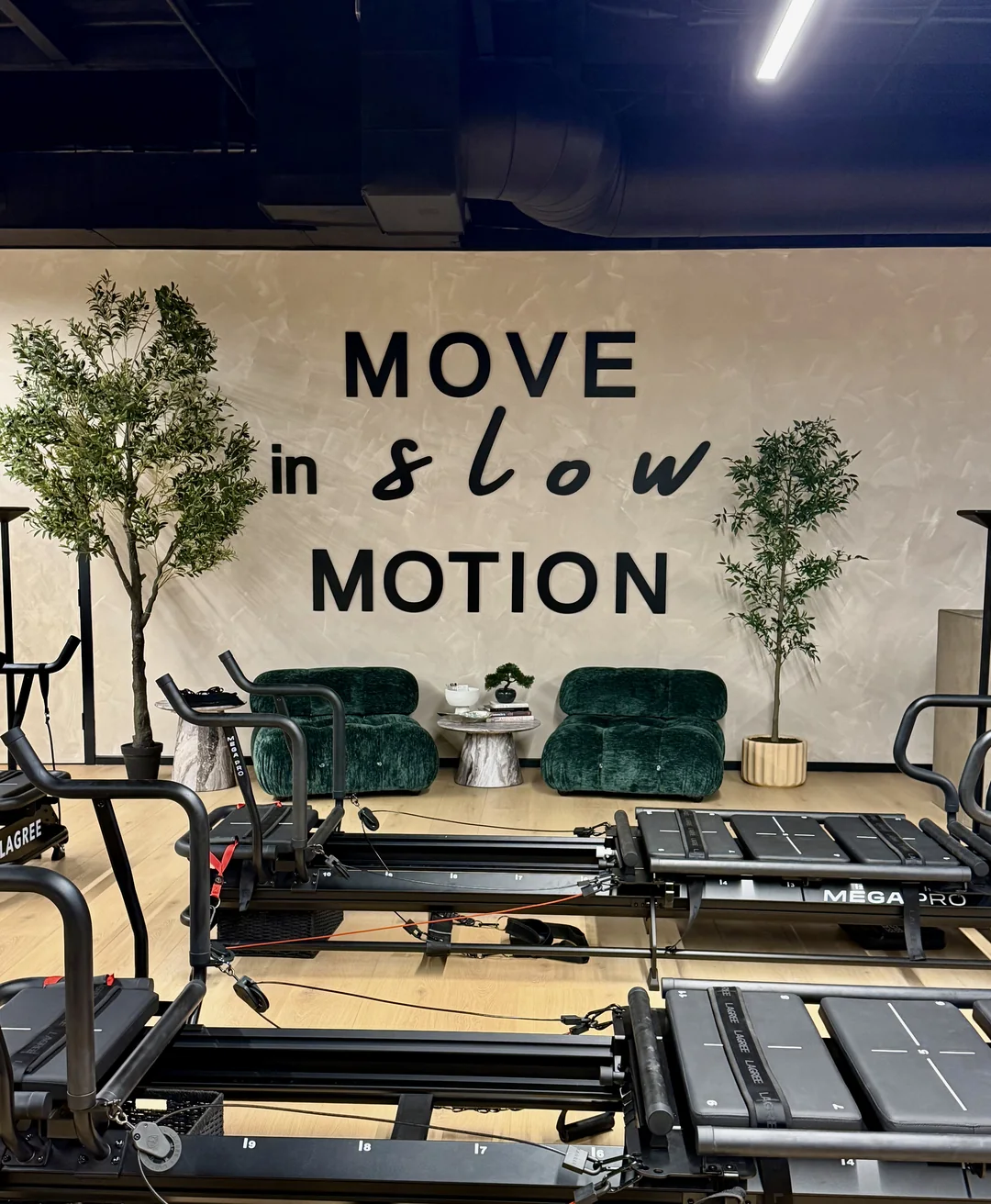 Lagree MD studio with Move in slow motion wall, where Lagree 101 begins