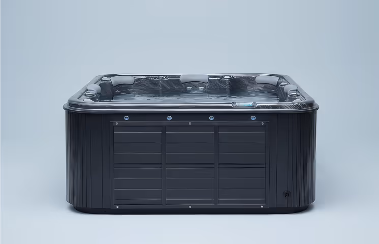 Modern black rectangular hot tub with built-in headrests on a plain light background.