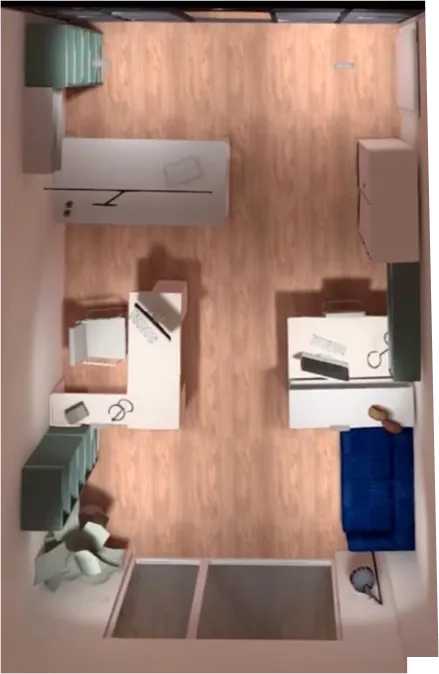 Vista dall'alto di un ufficio con due scrivanie, una poltrona verde, una libreria verde e un divano blu su pavimento in legno.