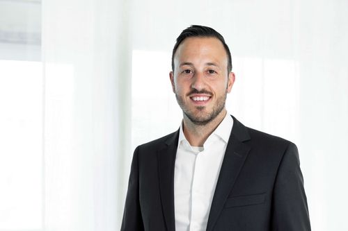 image of students collaborating on a digital project in a technology lab