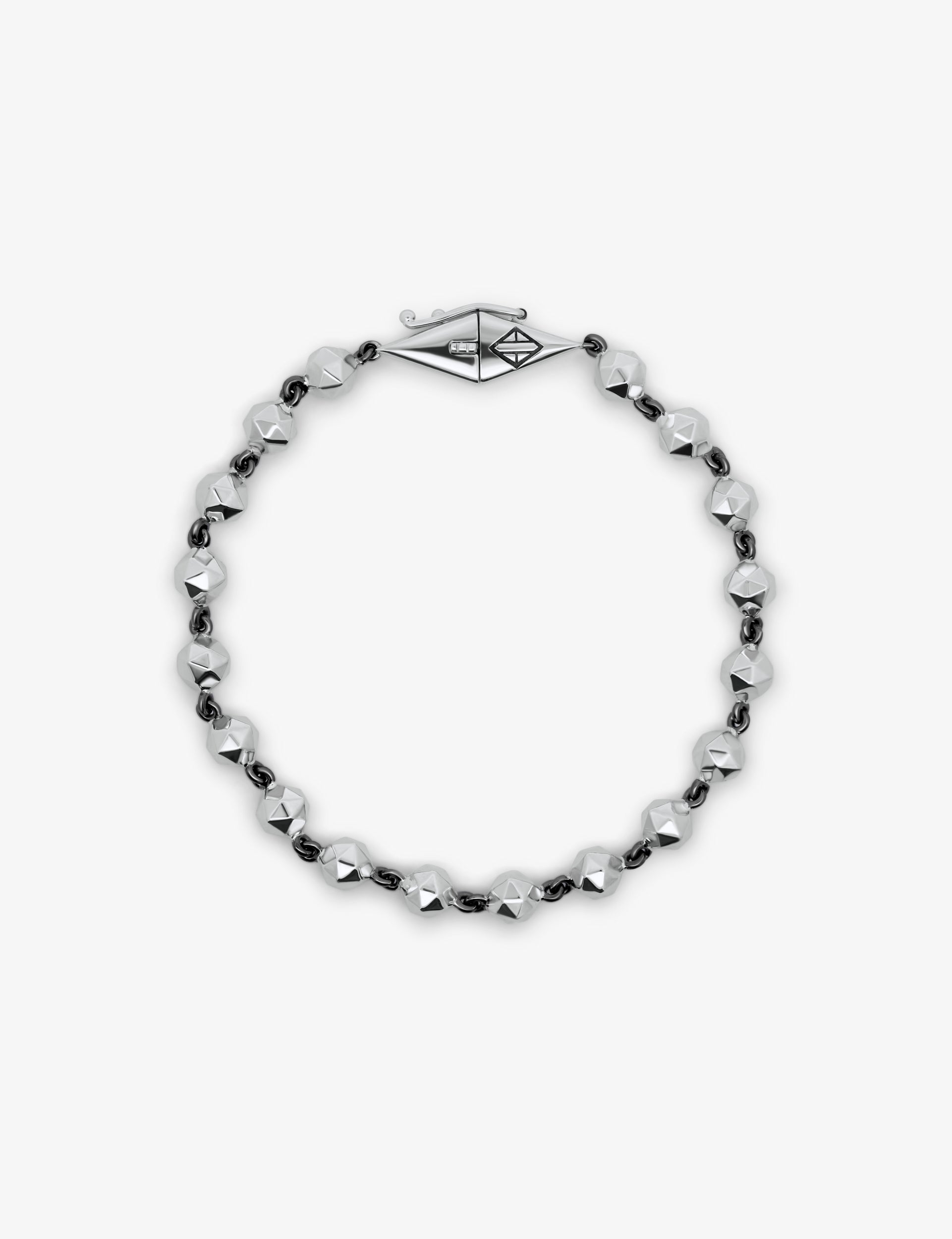 Bracelet with black and silver beads on a white background.