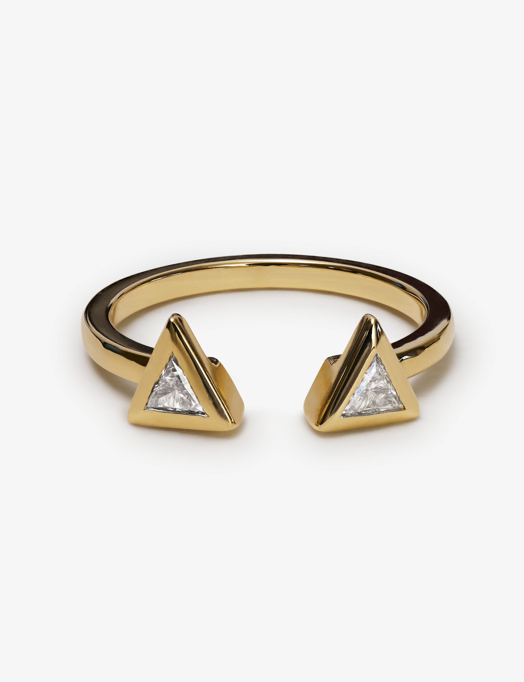 Yellow gold open ring with two triangular diamond settings facing each other.