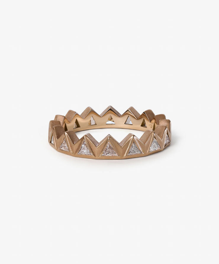 Gold and silver chevron patterned ring on a white background.