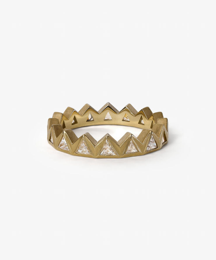 Gold and silver chevron patterned ring on a white background.