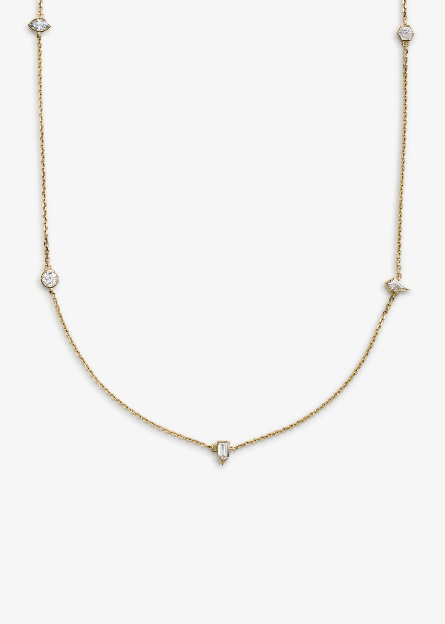 Elegant long gold chain necklace featuring bezel-set diamonds in various cuts, including round, square, and triangular shapes, displayed on a white background.