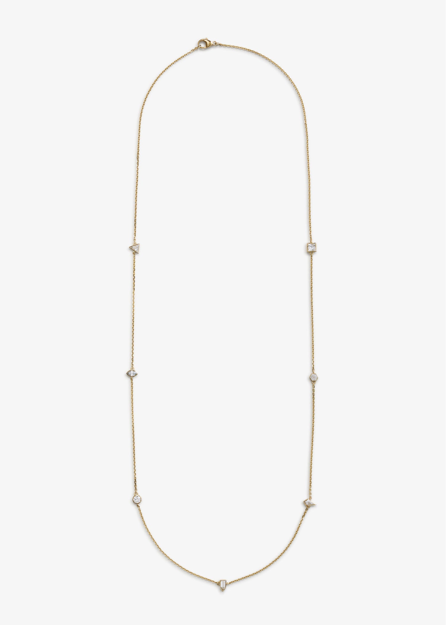Elegant long gold chain necklace featuring bezel-set diamonds in various cuts, including round, square, and triangular shapes, displayed on a white background.