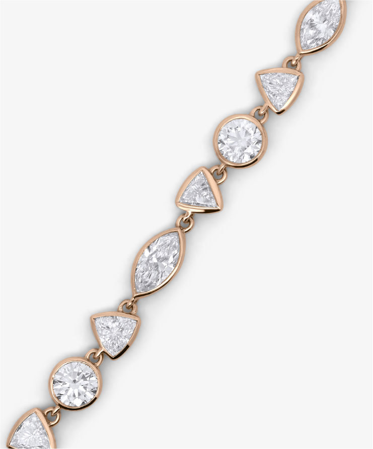 Gold chain bracelet on a white background.