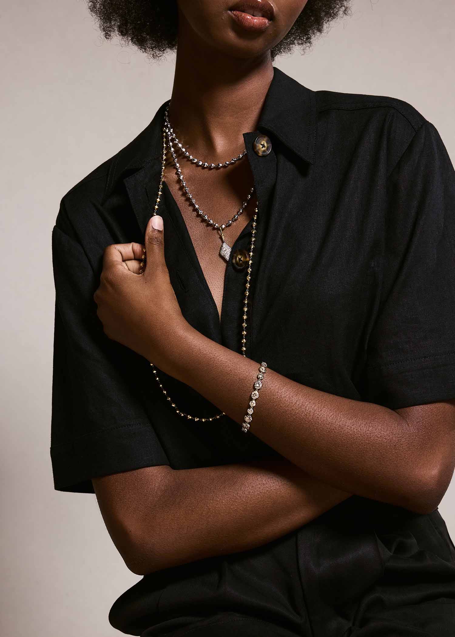 Model wearing facet bead necklace.