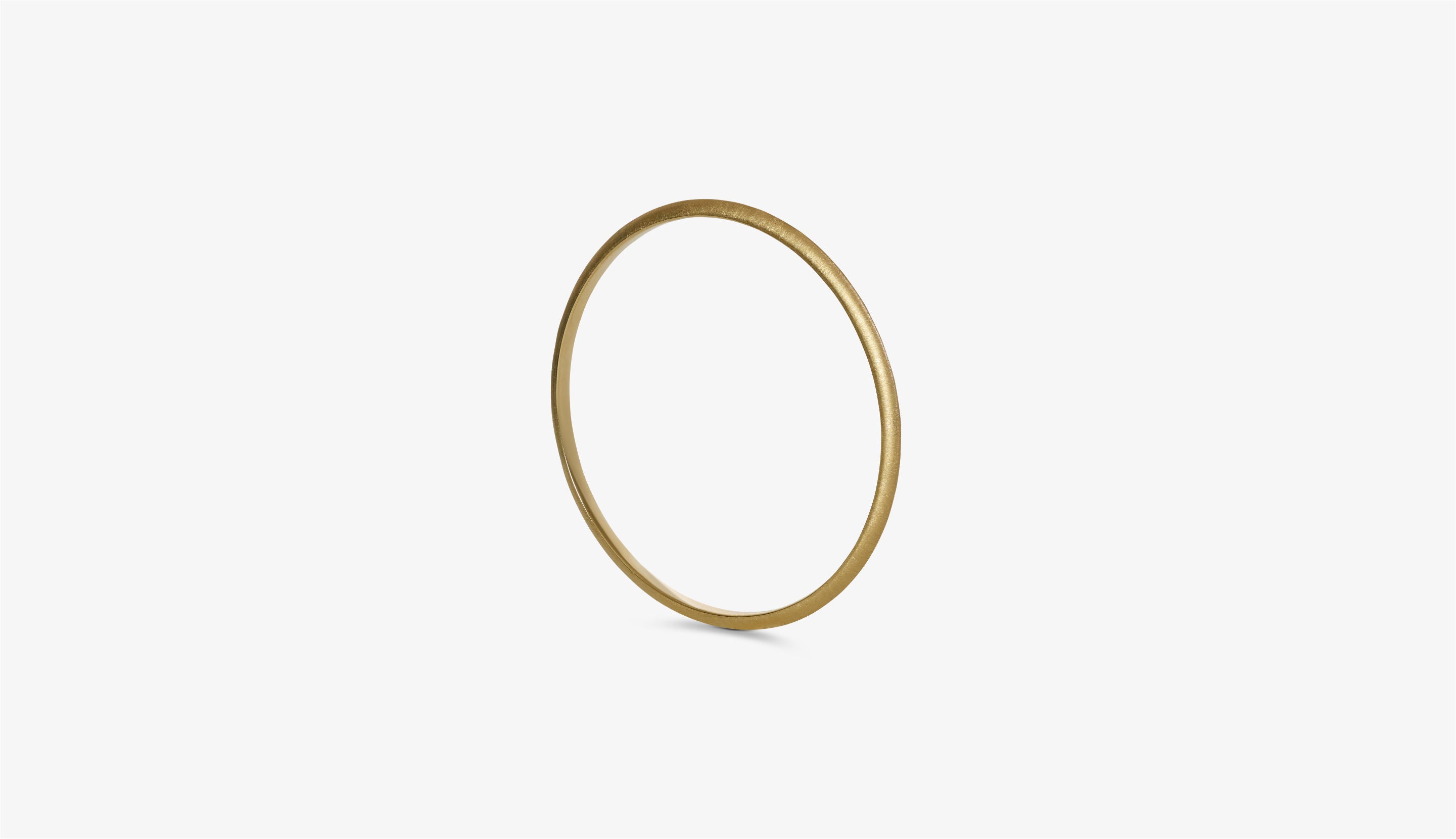 Blonde woman with slicked-back hair wearing a black strapless top and a choker necklace with a large light blue gemstone.