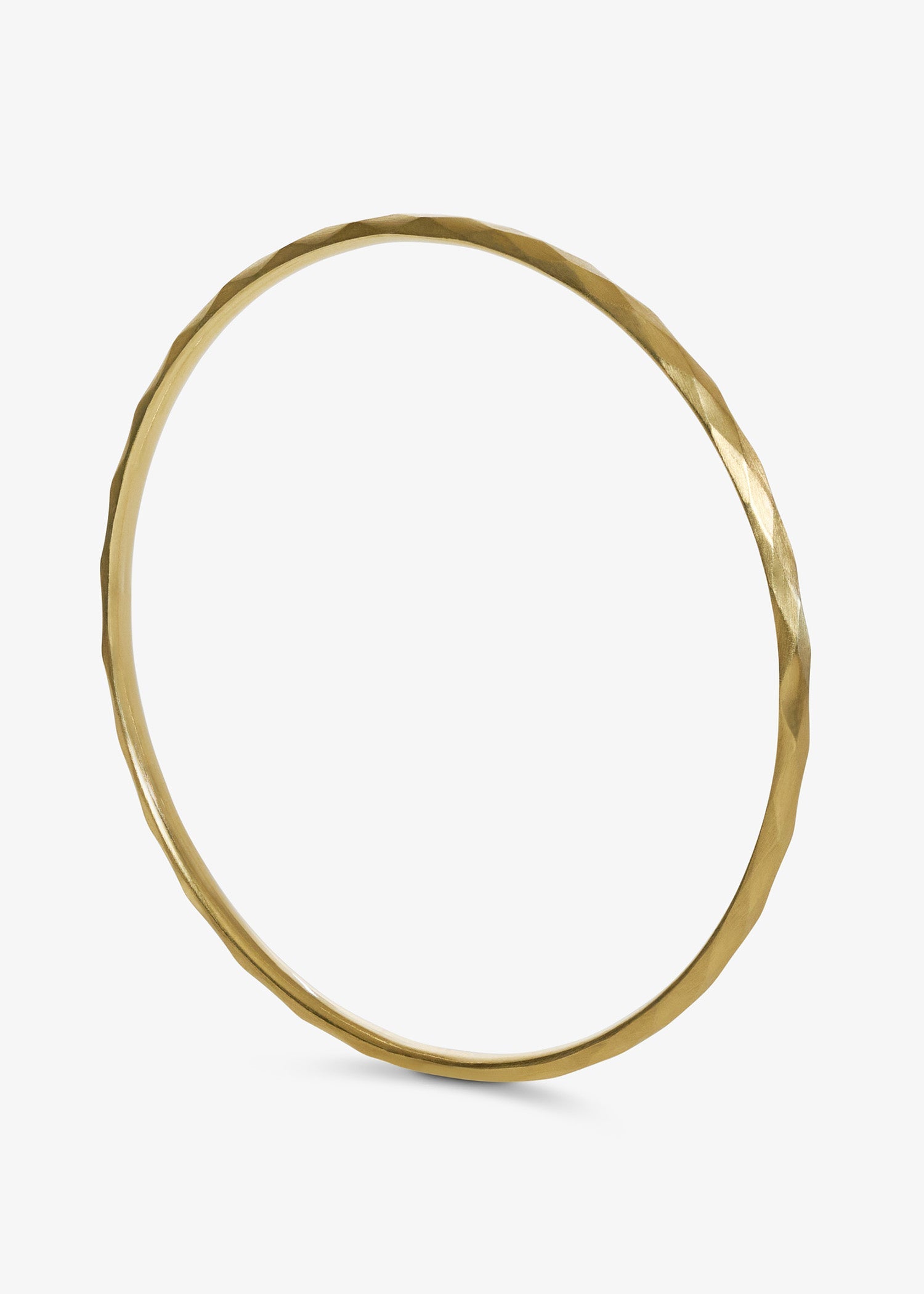 White gold faceted bangle with a subtle hammered texture on a white background.