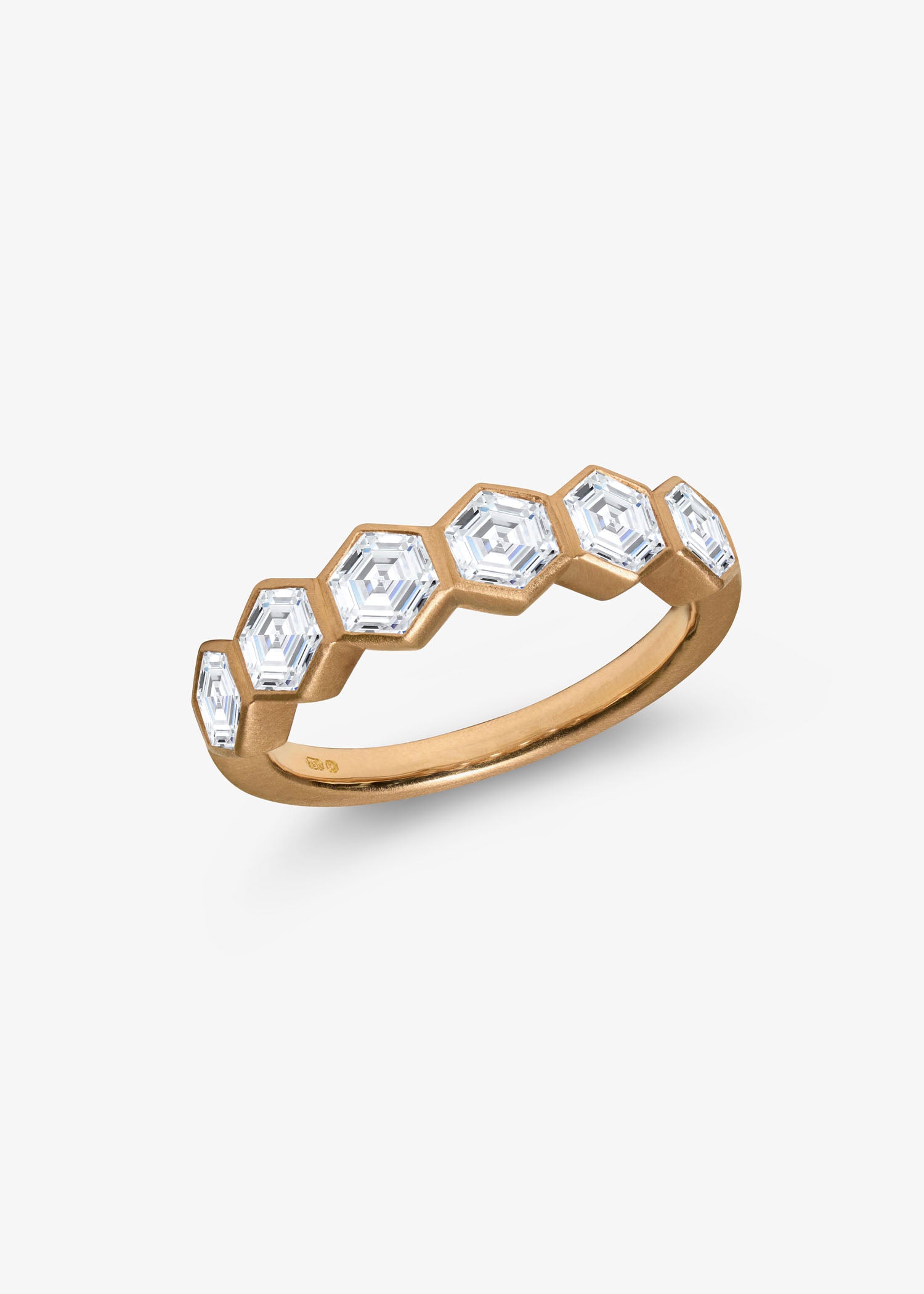 18k gold hexagon diamond eternity ring displayed on a white background.