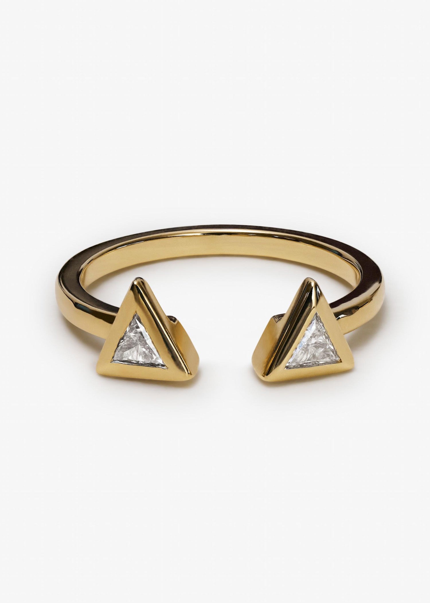 Yellow gold open ring with two triangular diamond settings facing each other.