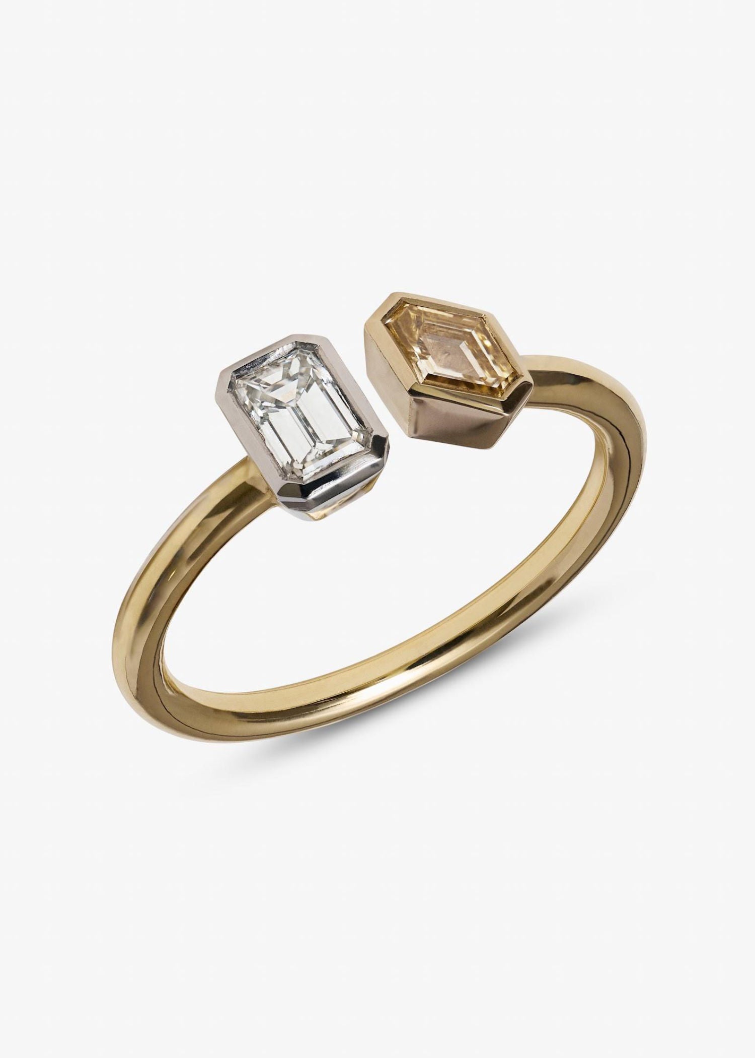 Yellow gold toi et moi ring showcasing twin emerald-cut diamonds in white and champagne tones.