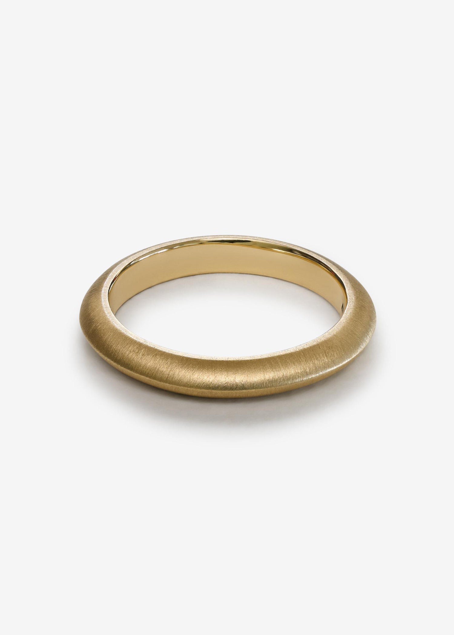 Gold ring on a white background.