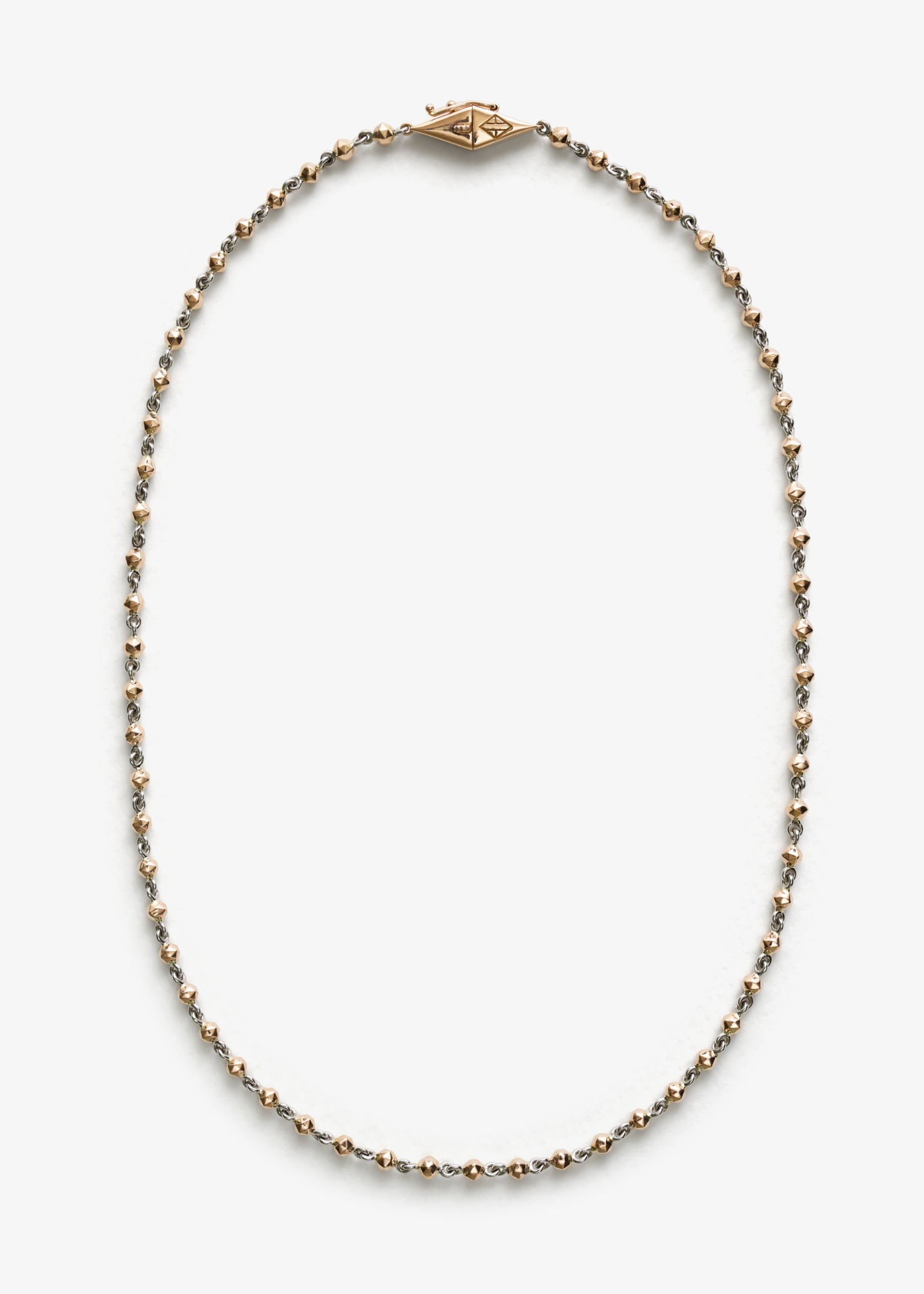 Necklace with gold and silver beads on a white background.