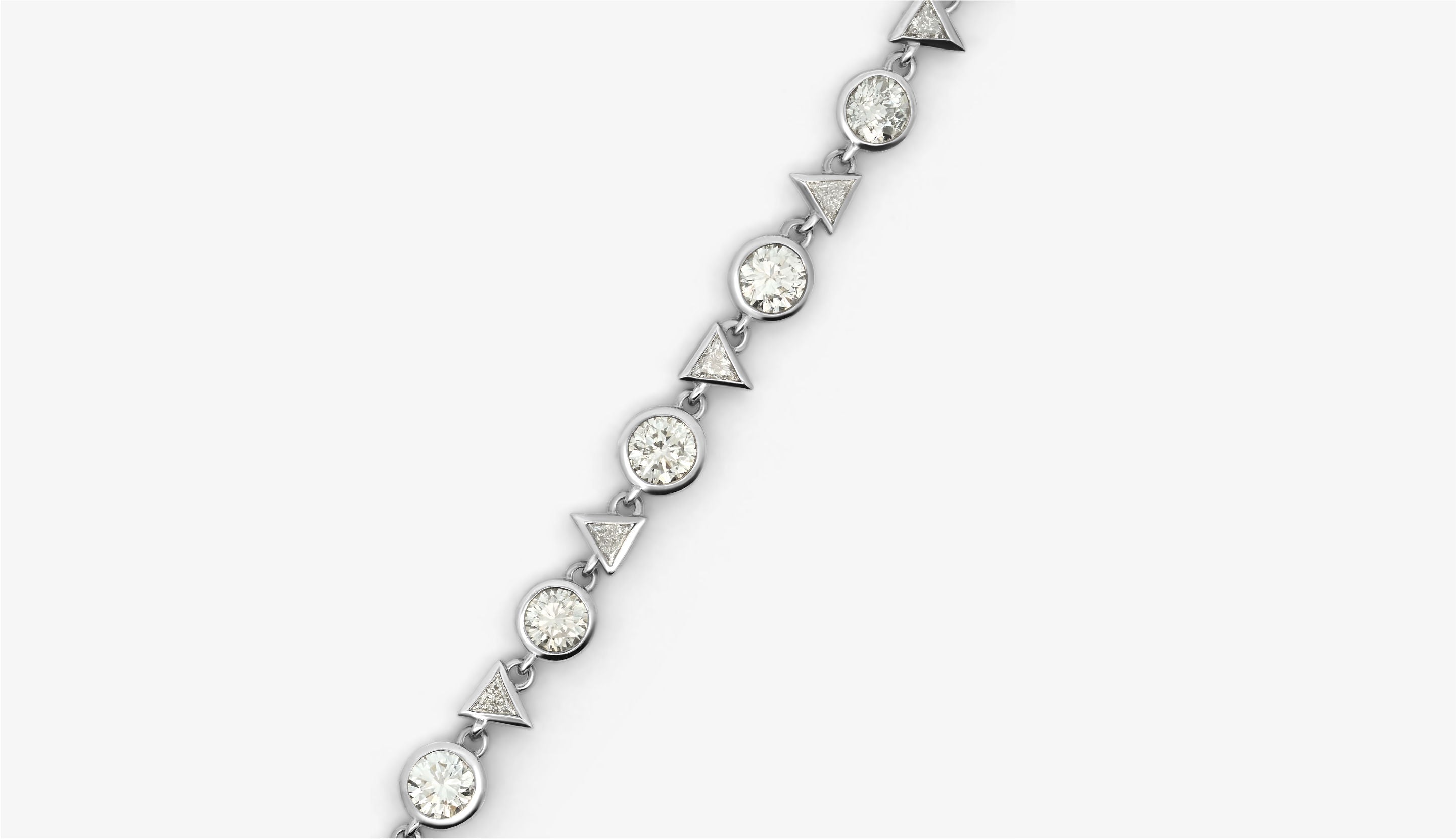 Blonde woman with slicked-back hair wearing a black strapless top and a choker necklace with a large light blue gemstone.