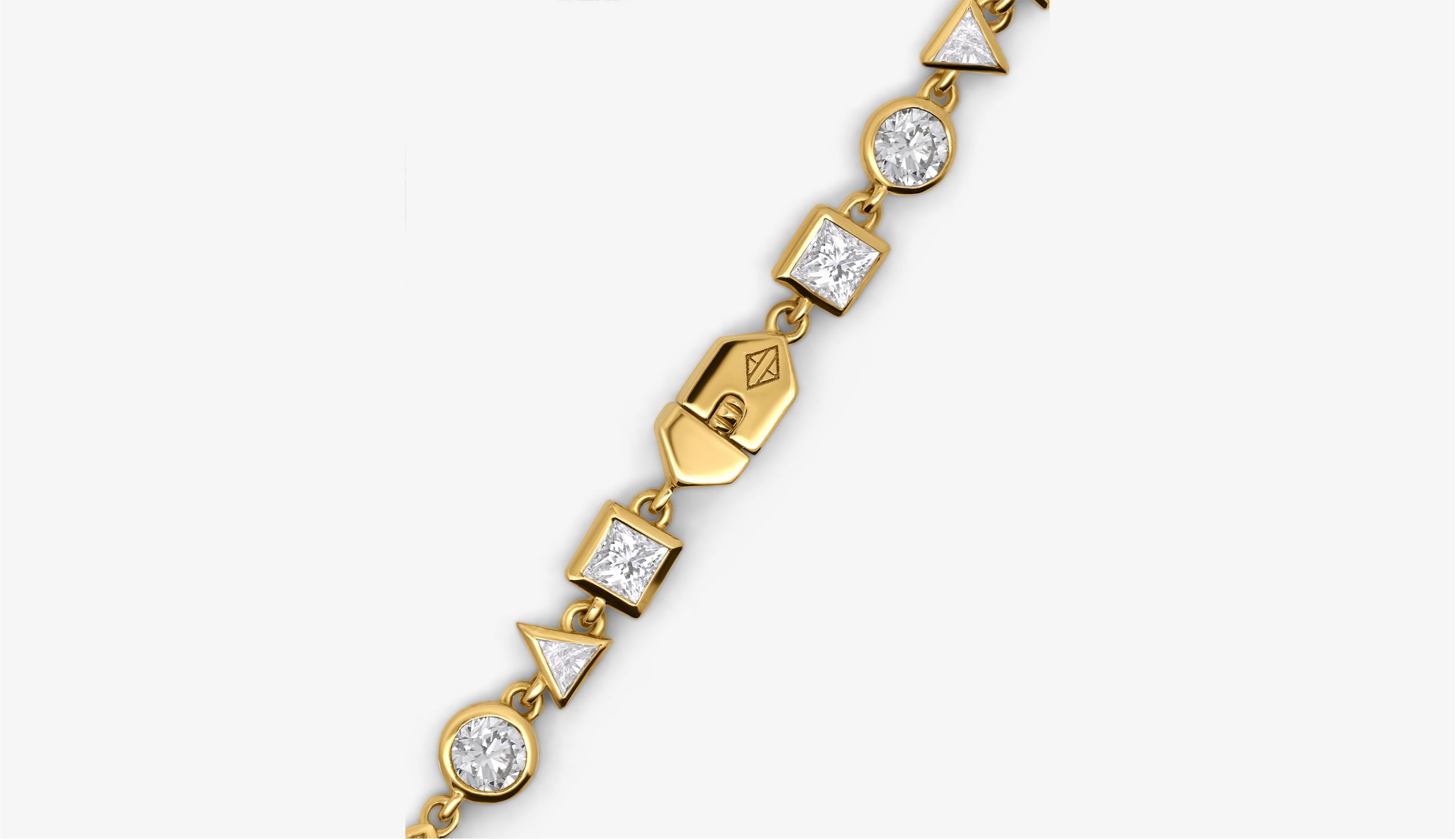 Blonde woman with slicked-back hair wearing a black strapless top and a choker necklace with a large light blue gemstone.