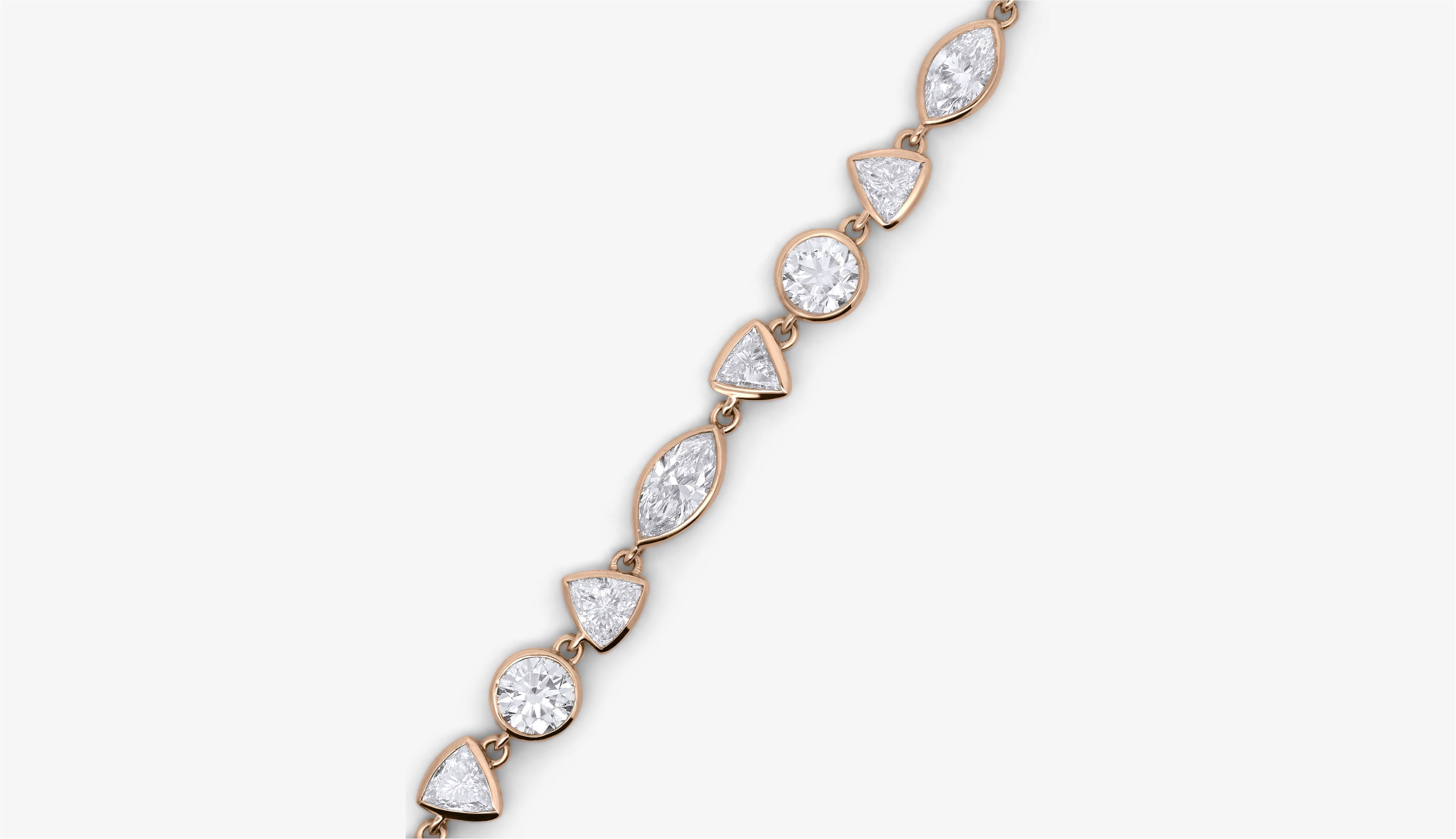 Blonde woman with slicked-back hair wearing a black strapless top and a choker necklace with a large light blue gemstone.