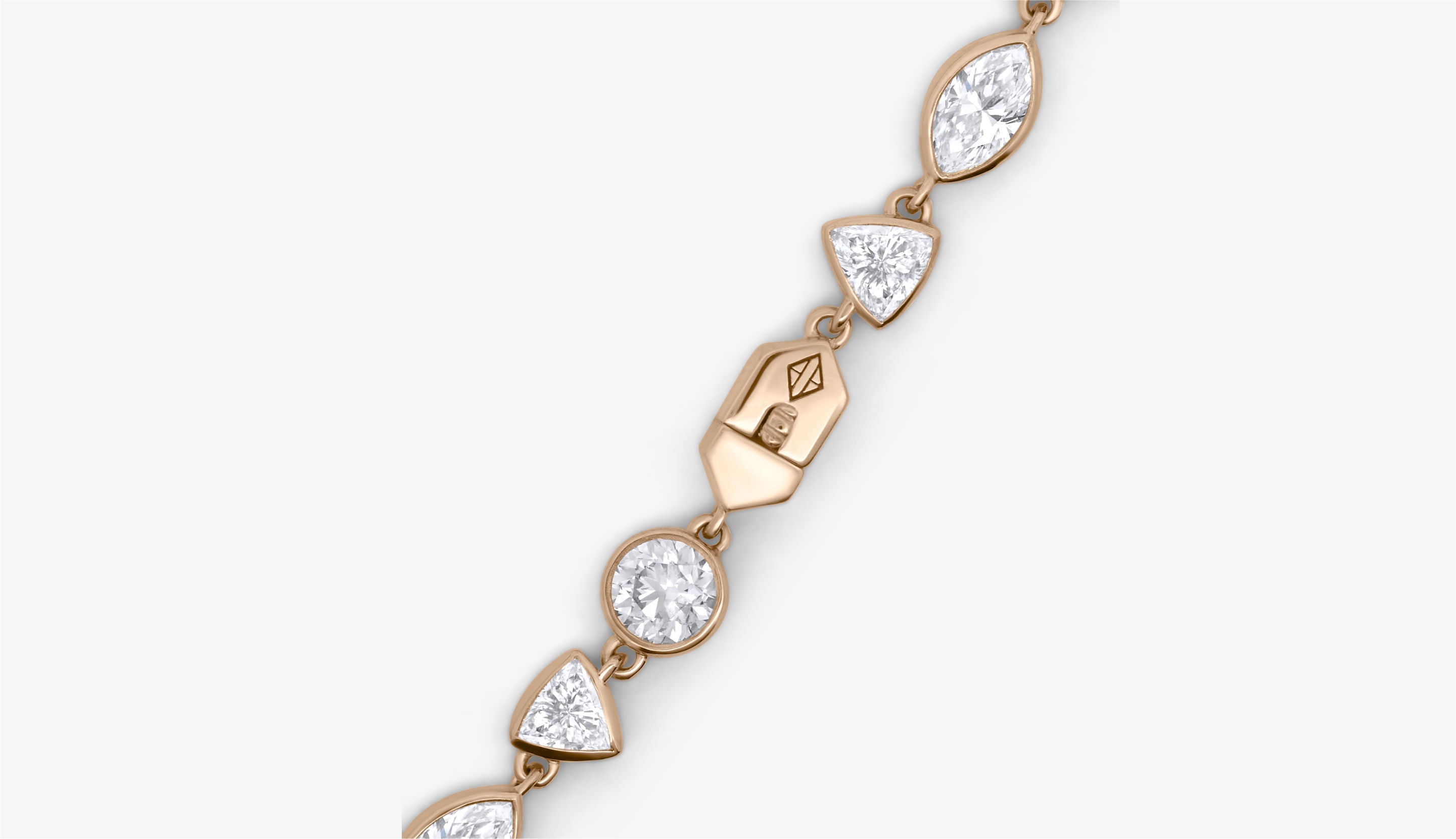 Blonde woman with slicked-back hair wearing a black strapless top and a choker necklace with a large light blue gemstone.