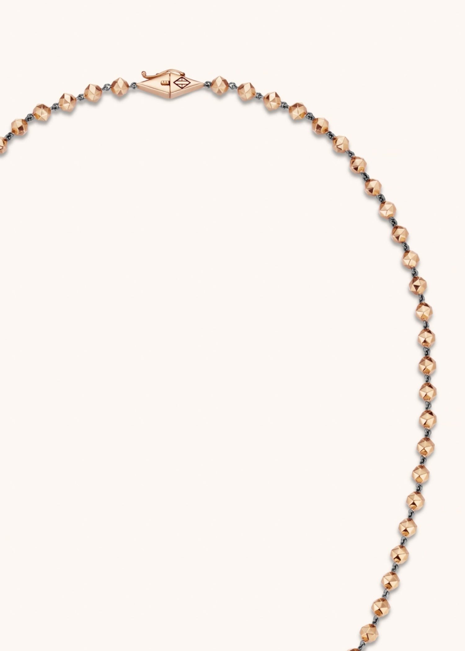 Model wearing white gold facet bead necklace.