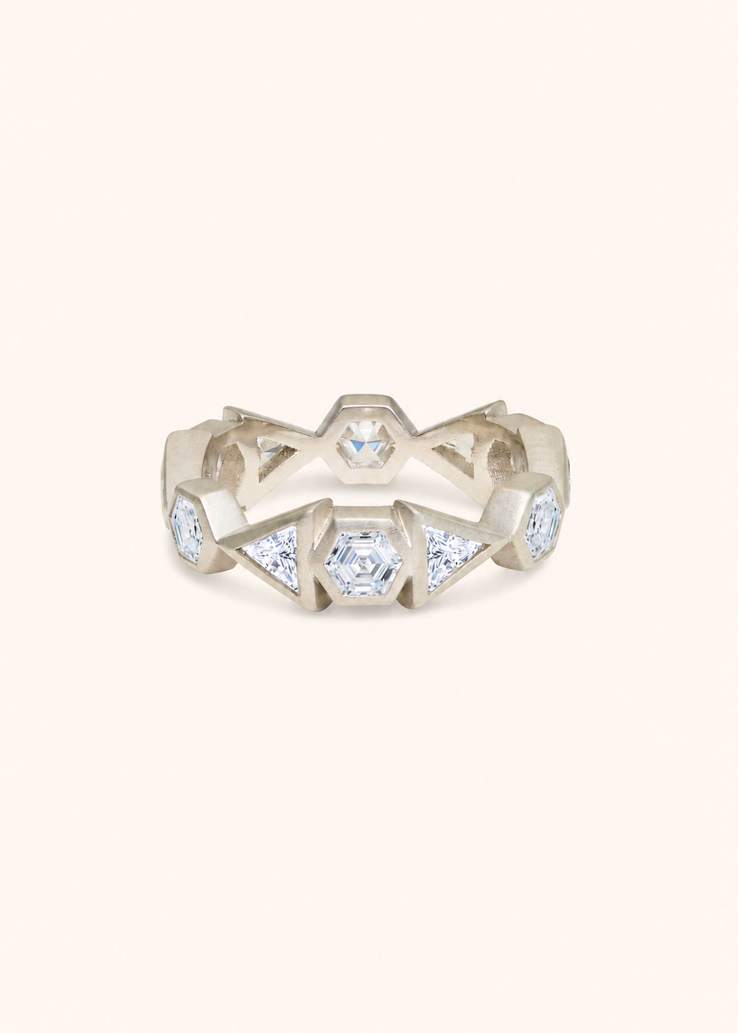 Gold ring with diamond accents on a white background.