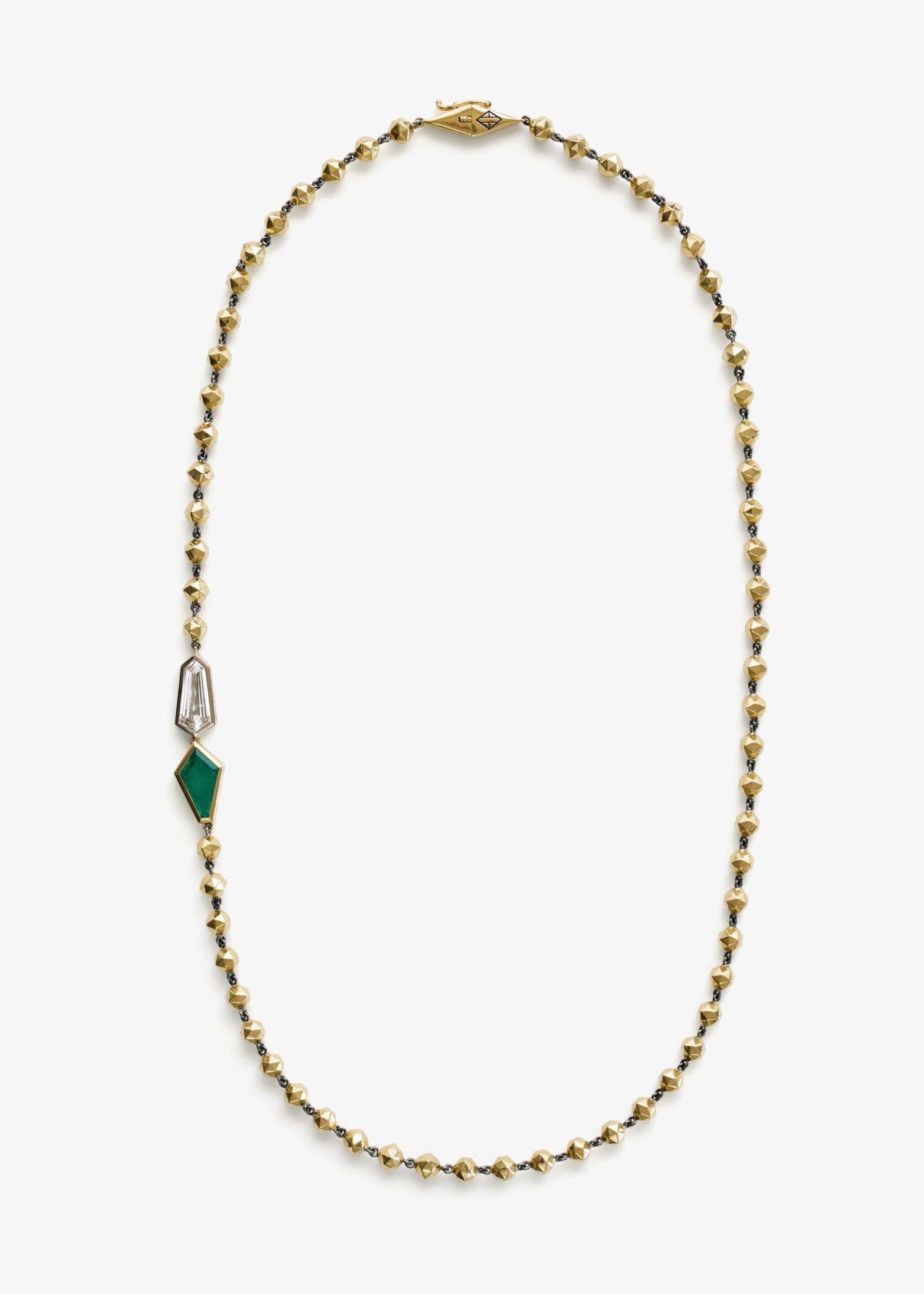 Gold bead necklace featuring a geometric emerald and diamond pendant detail, displayed on a white background.