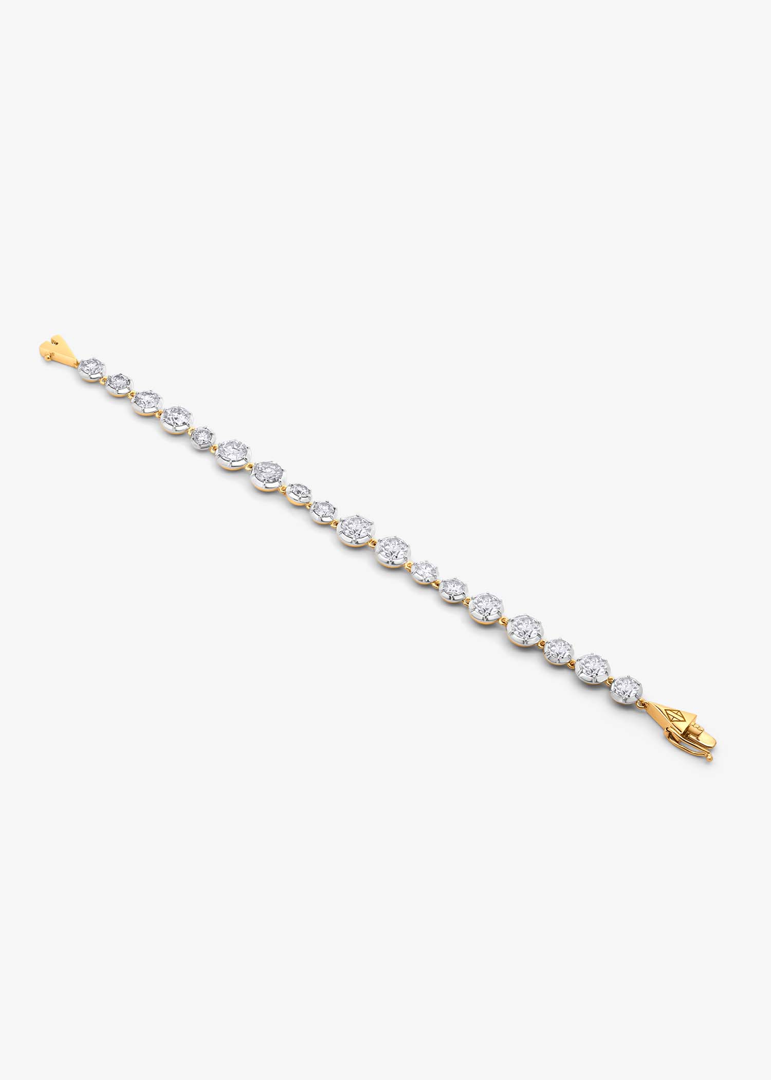 Full view of gold diamond tennis bracelet laid flat on a white background showing its geometric clasp.