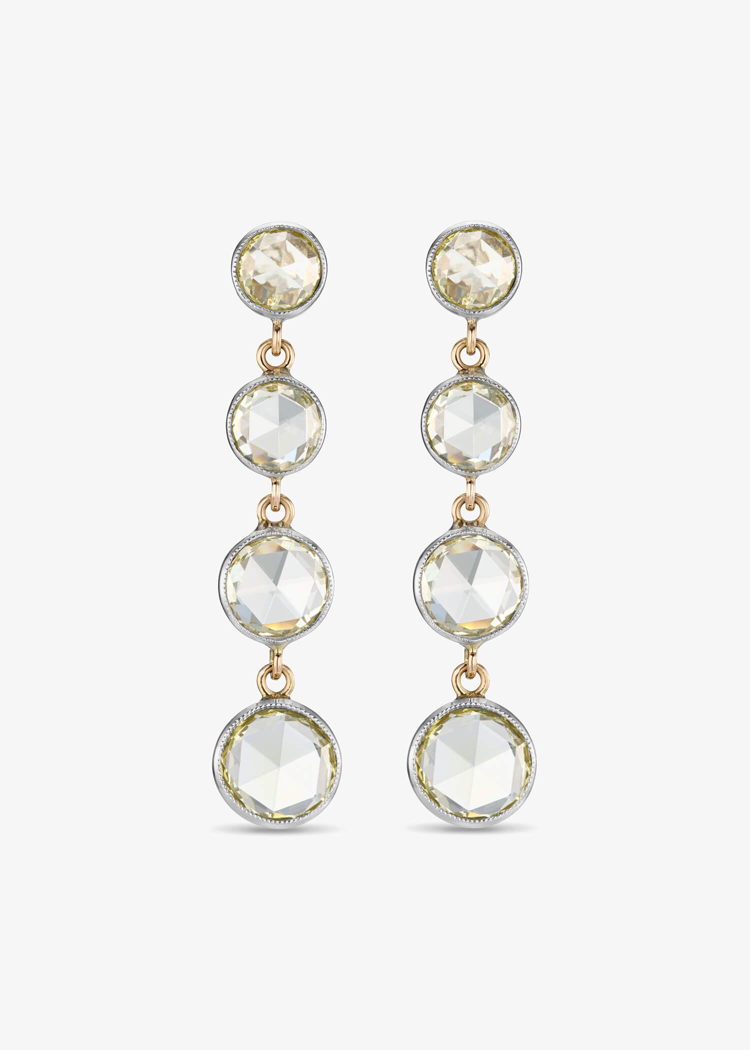 Diamond Drop Earrings with delicate dangling diamonds in a minimalist fine jewelry design.