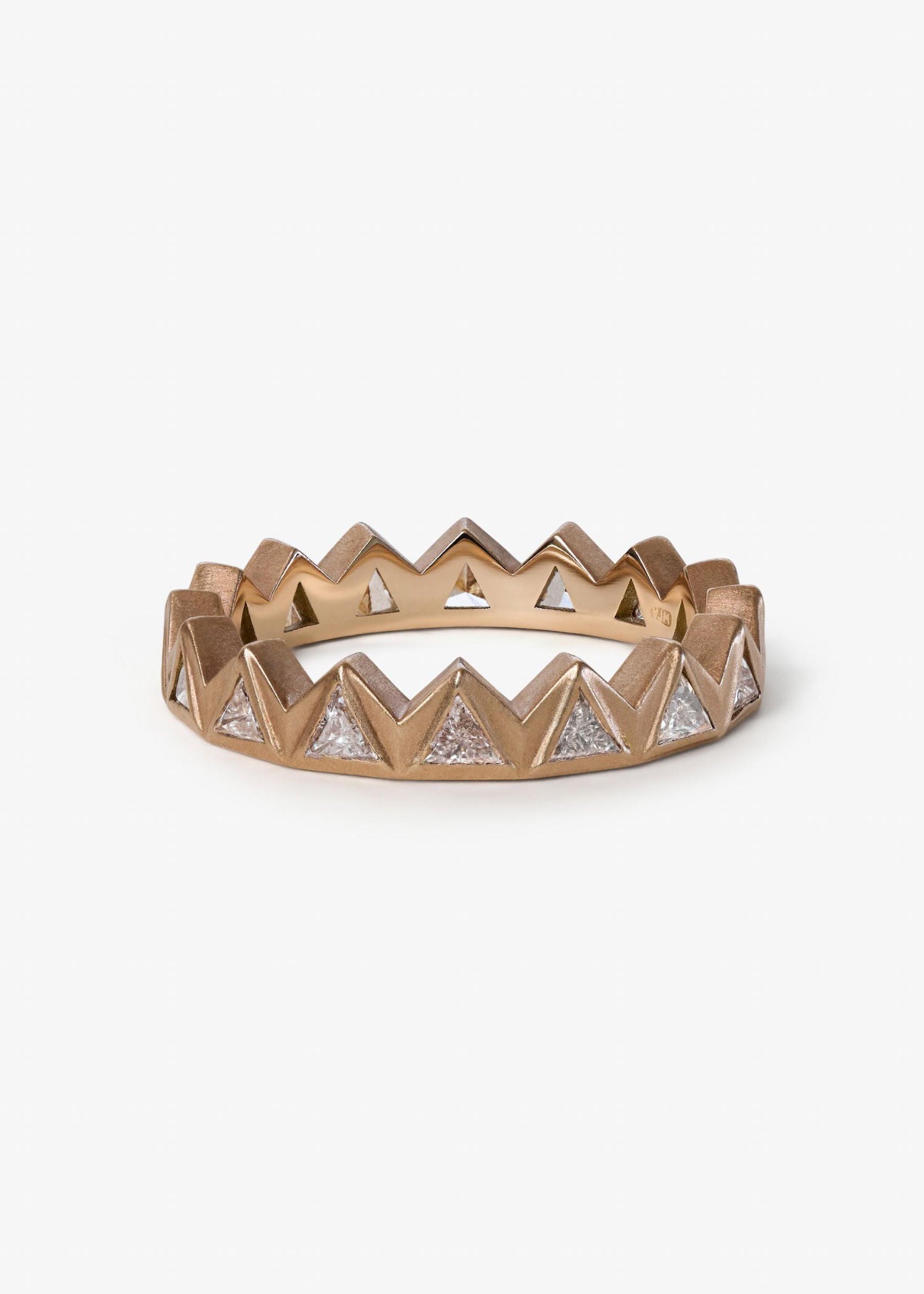 Jigsaw Trilogy Ring featuring three interlocking bands with a contemporary fine jewelry aesthetic.