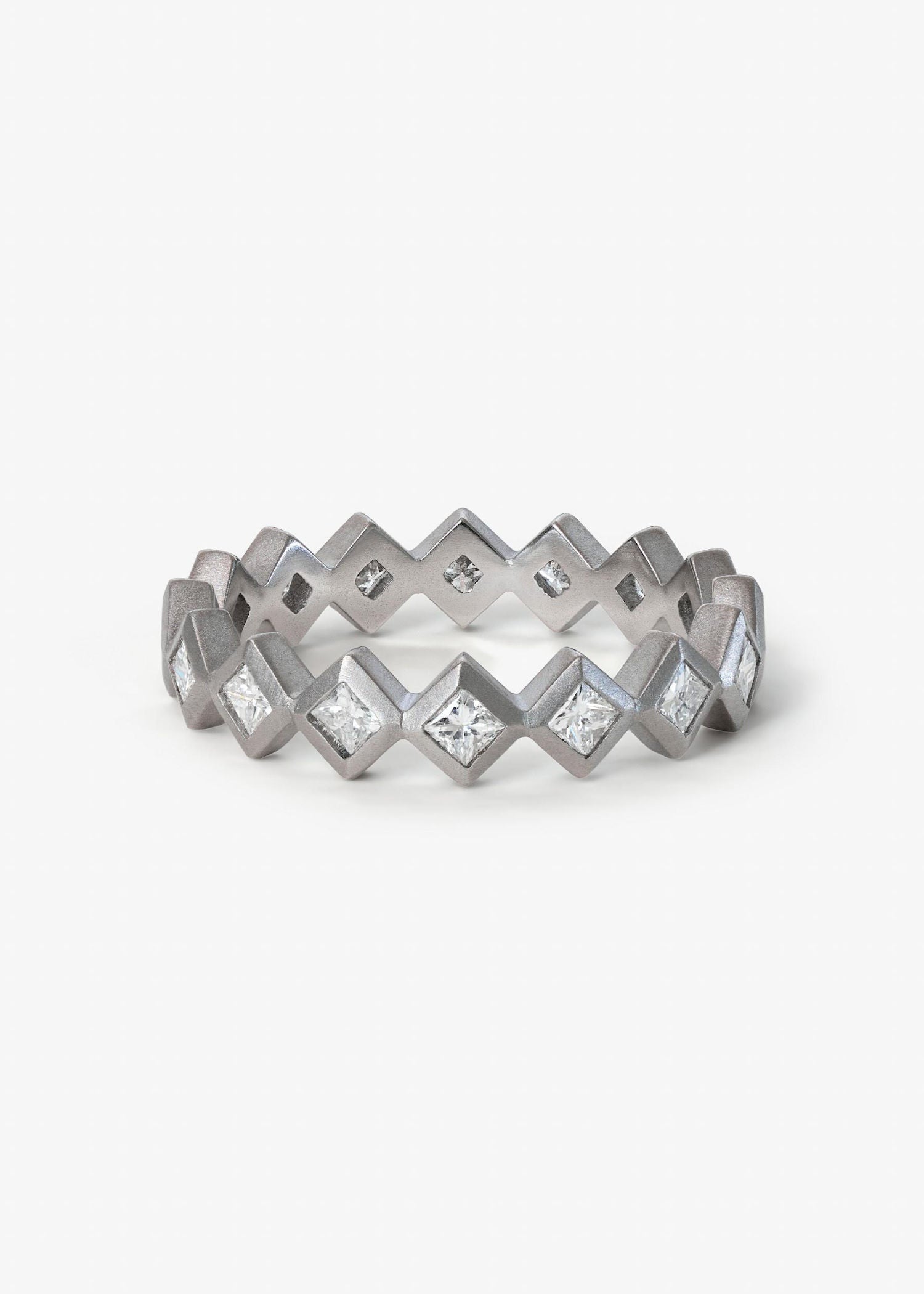 Jigsaw Diamond Ring featuring interlocking bands with diamond accents in a contemporary design.