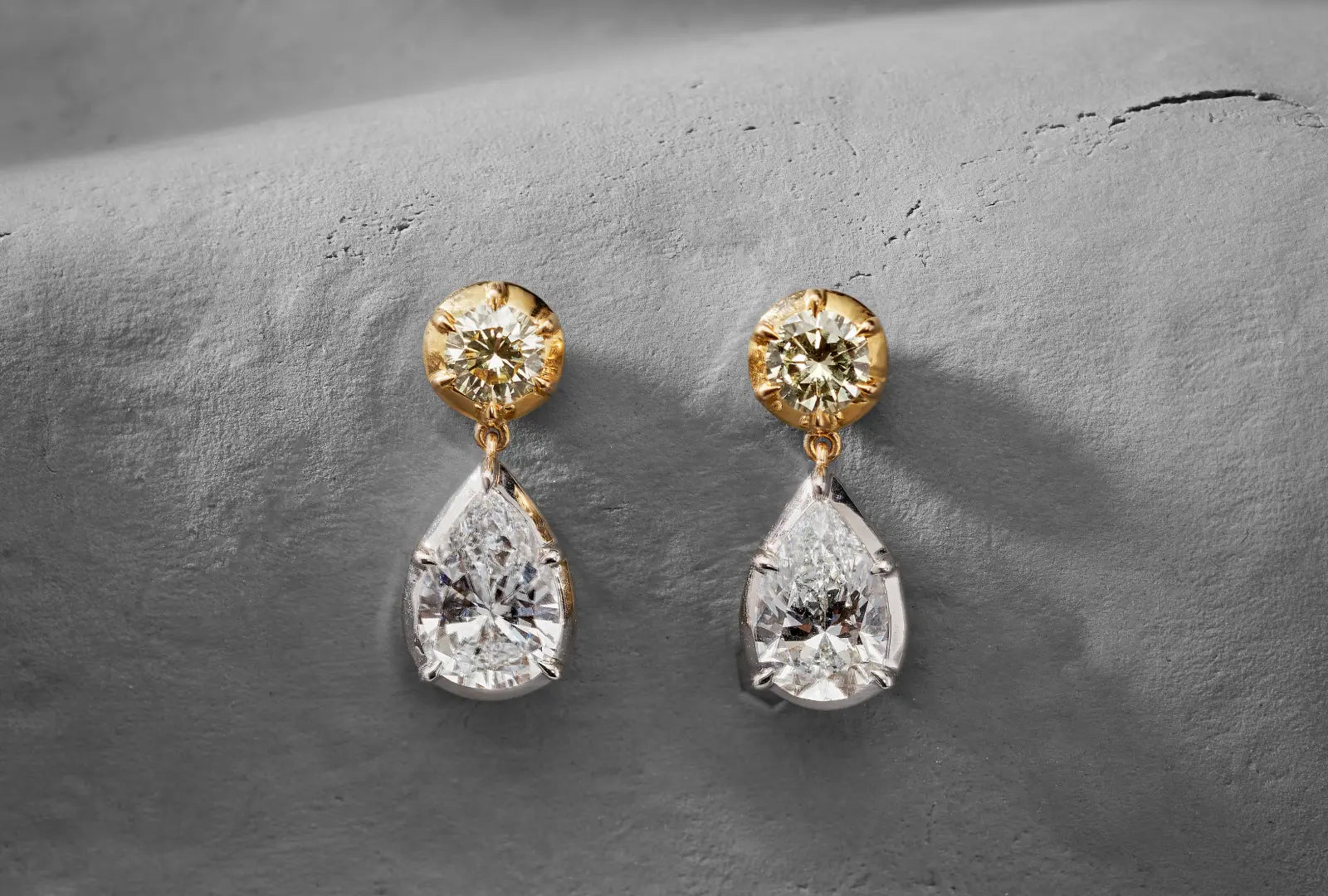 Diamond stud earrings collection featuring yellow gold and platinum designs with diamond accents.