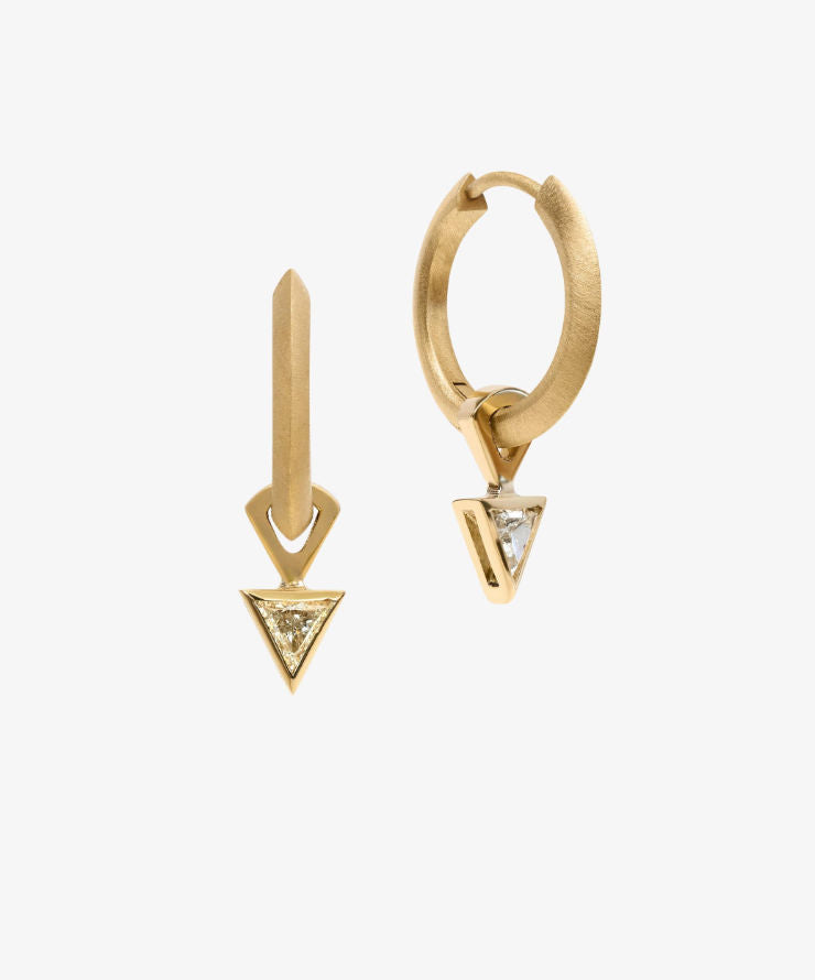 Yellow gold earrings featuring triangle-cut diamonds in sleek geometric drop design on white background.