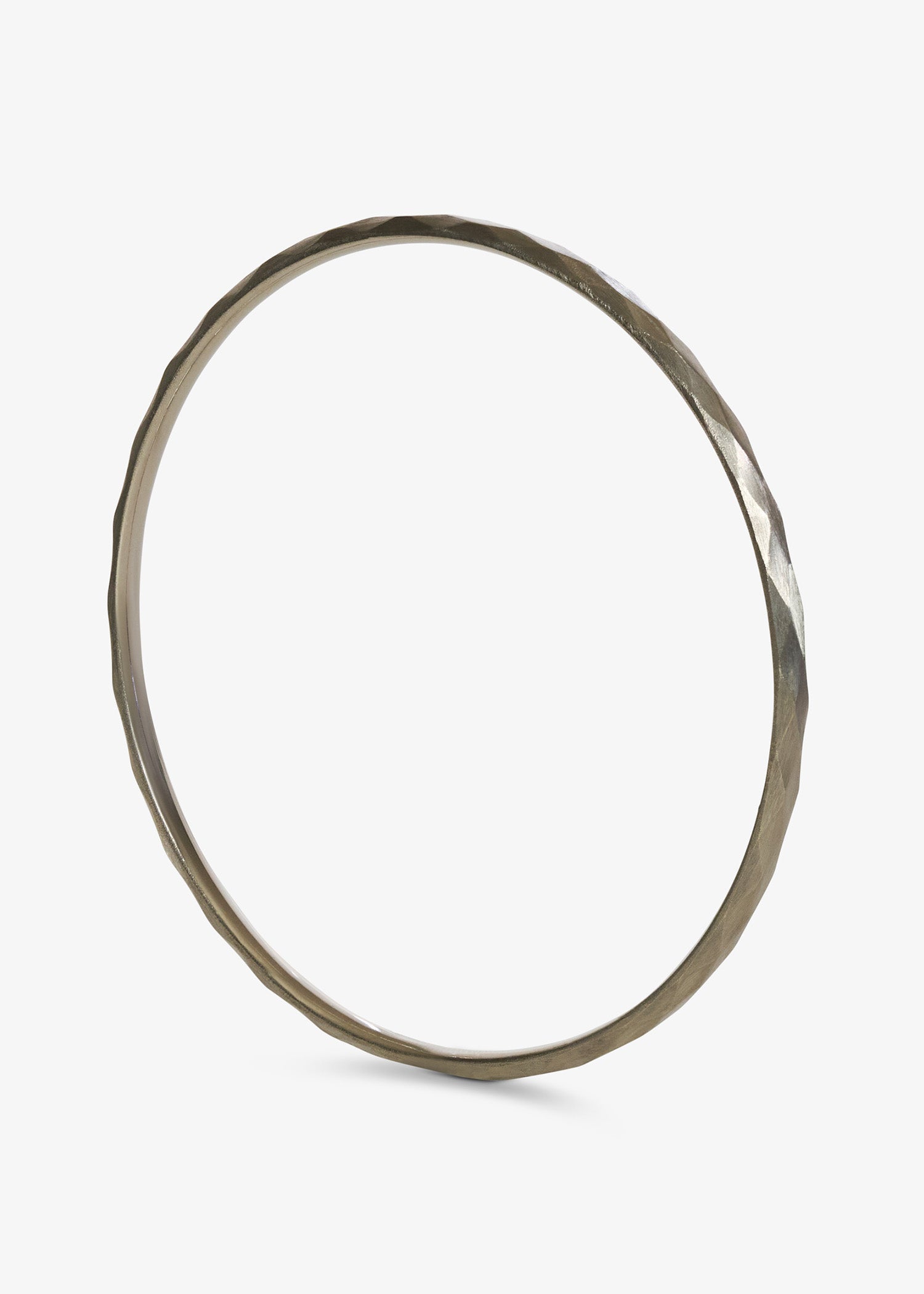 White gold facet bangle in white background.