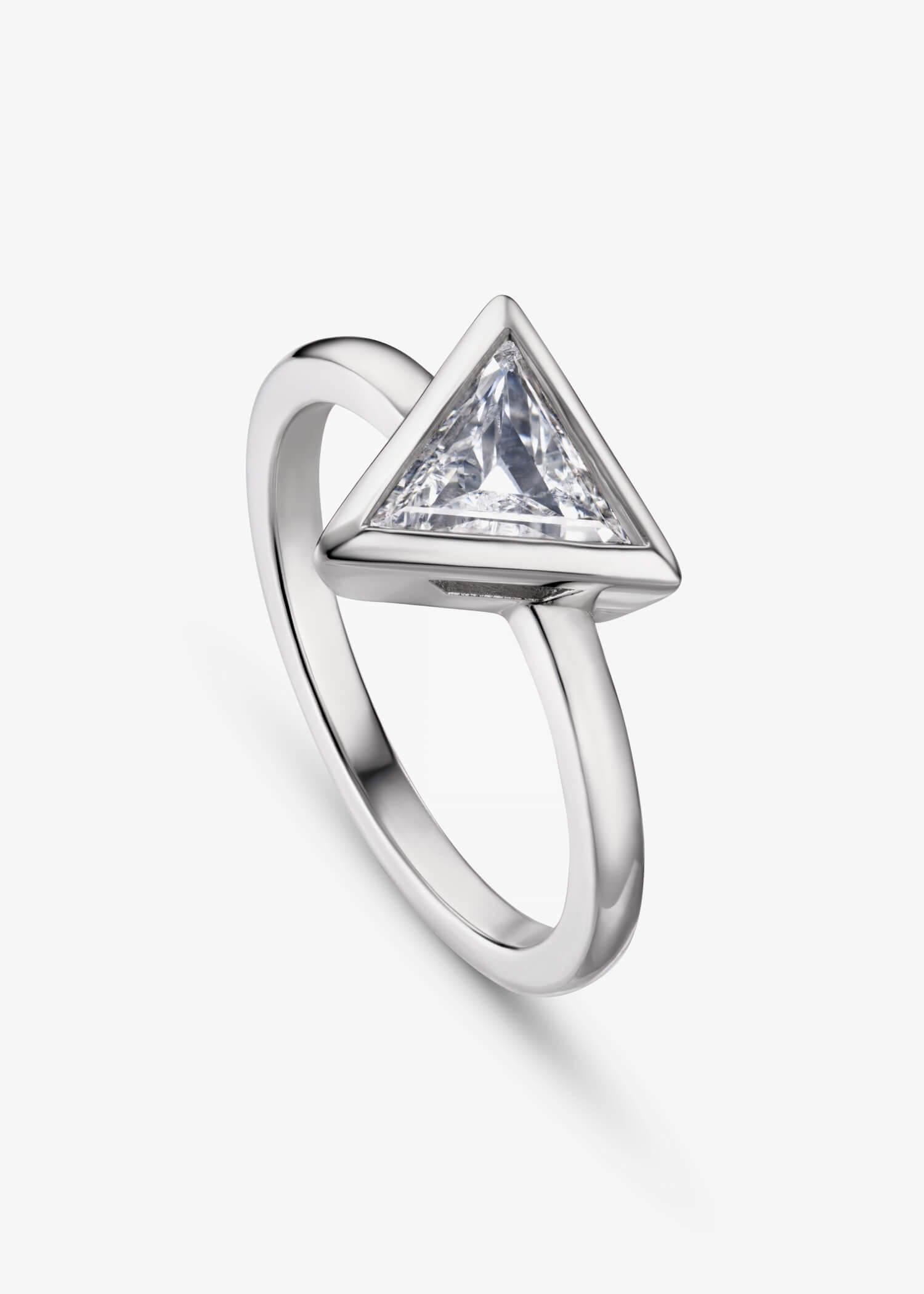 White gold ring with single triangular diamond in minimalist bezel setting.