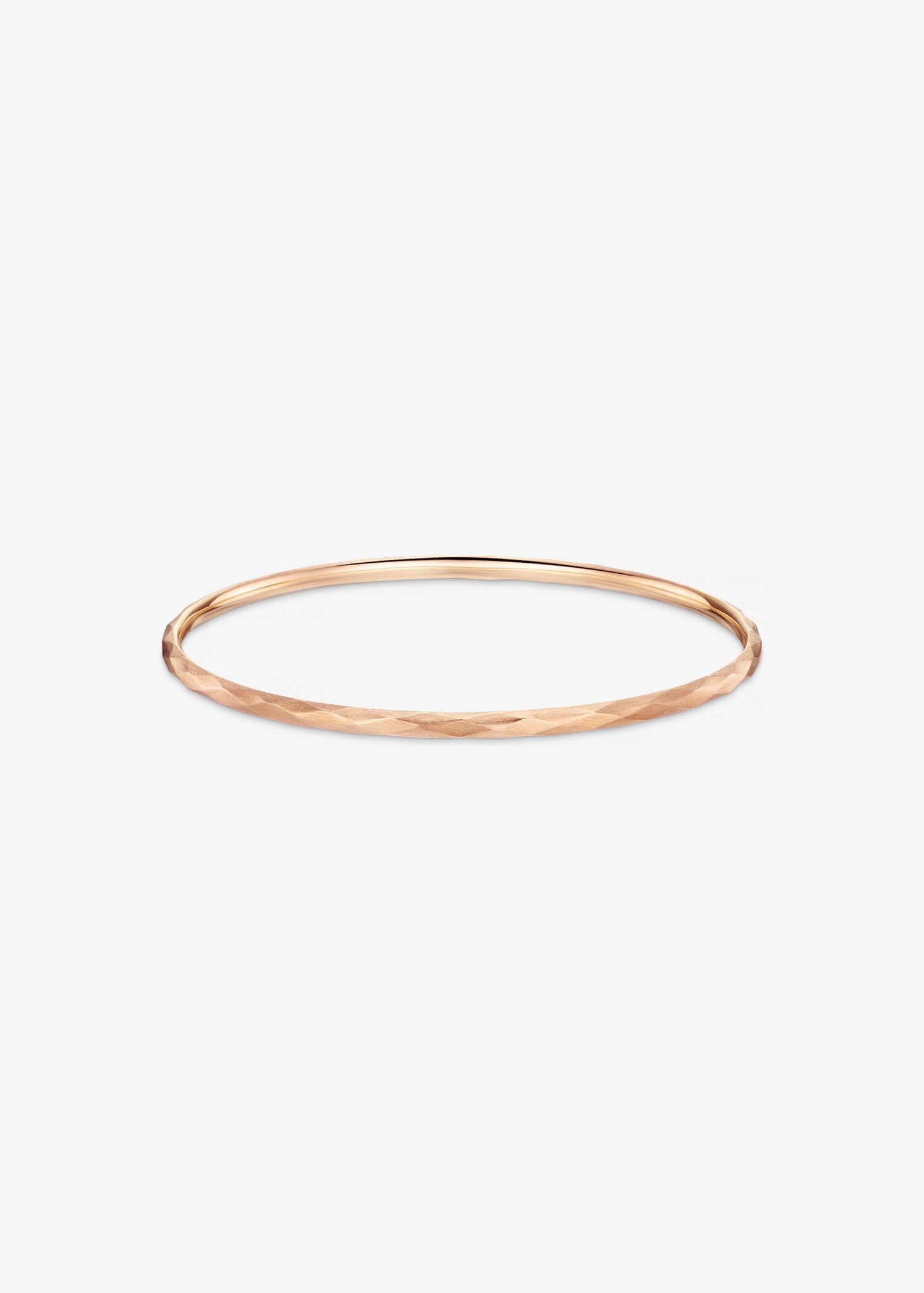 18k rose gold bangle bracelet with a sleek minimalist profile.