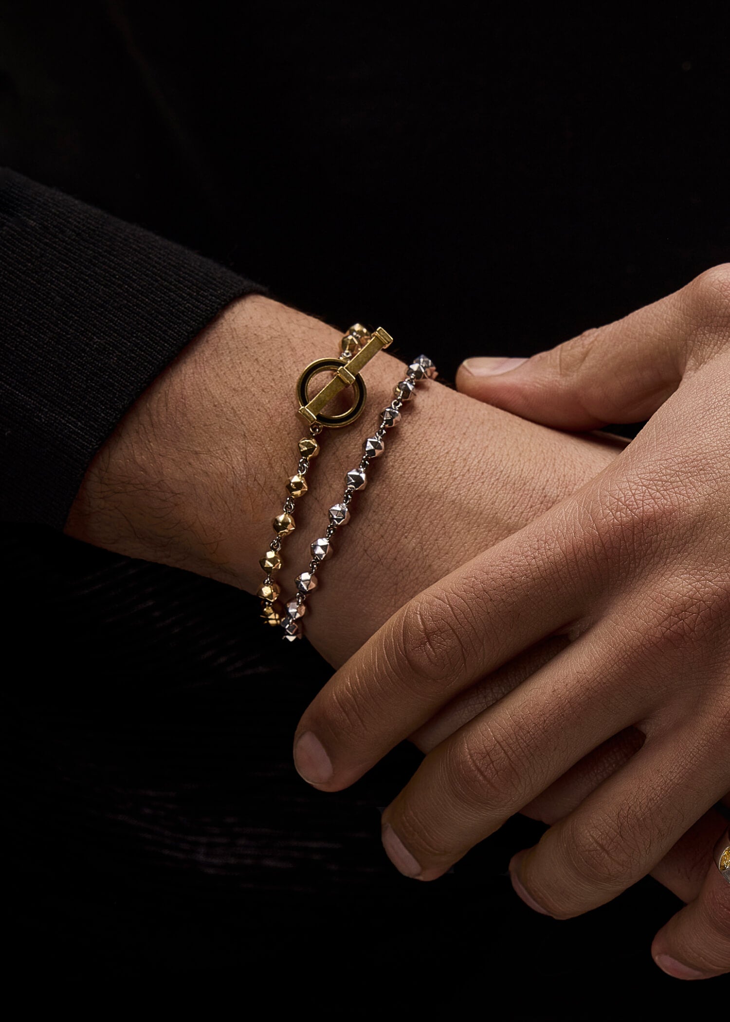 T Bar Bead bracelet in 18k yellow gold worn on the wrist with a beaded chain and toggle clasp.