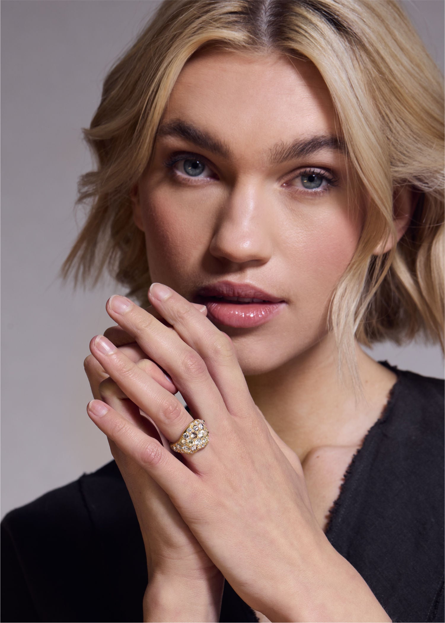 Punk Diamond Ring worn by a model featuring diamond accents and a contemporary jewelry design.