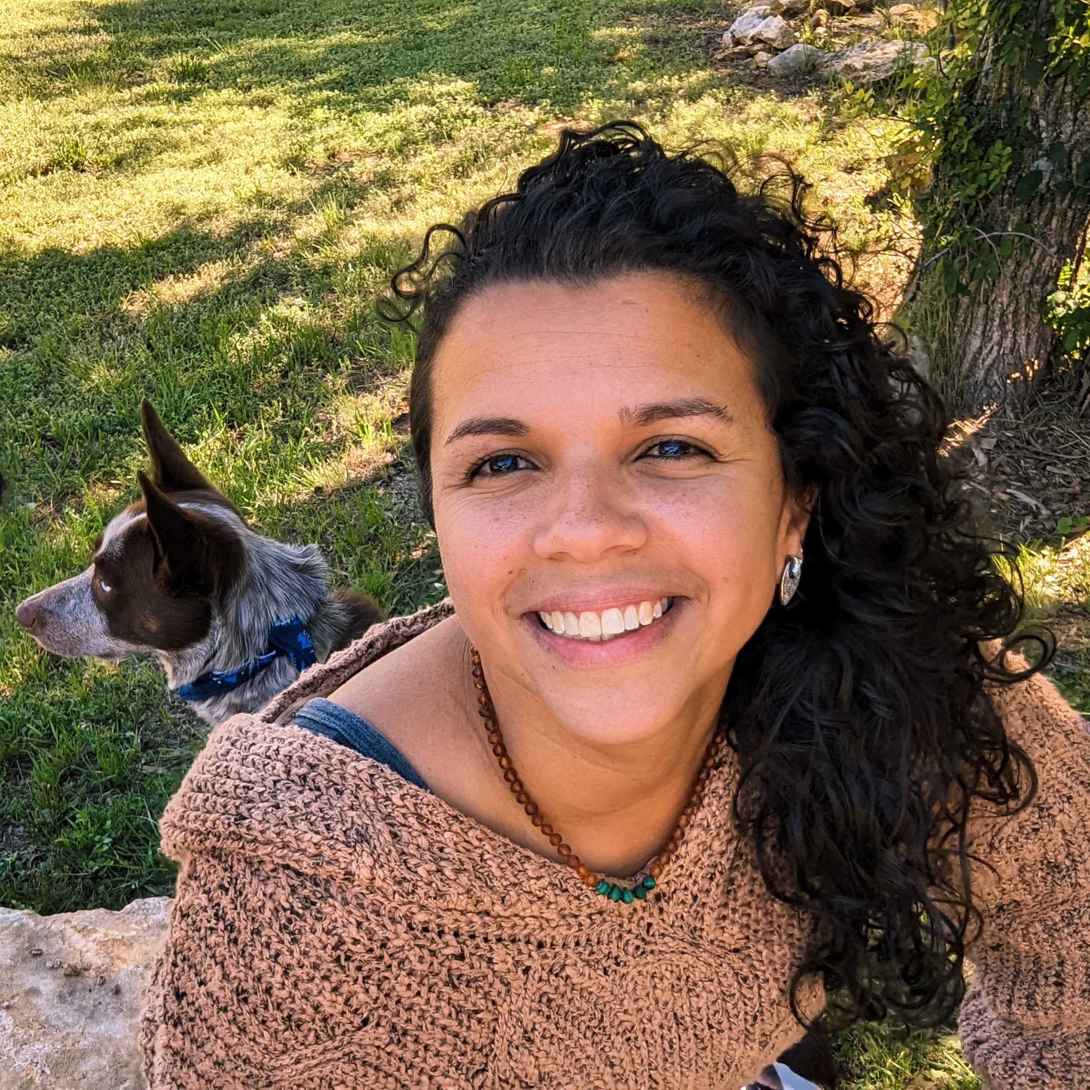 Photo of Caren smiling.