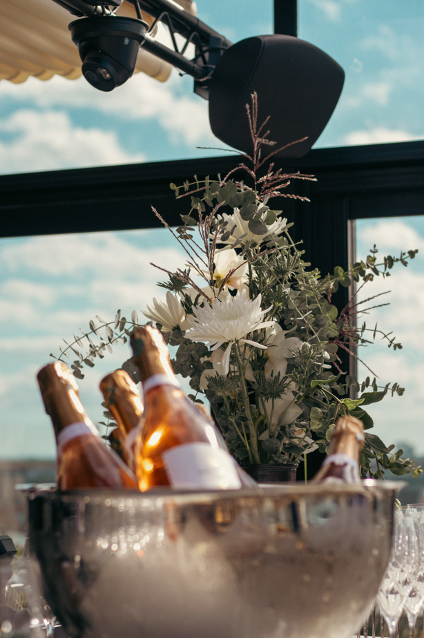 Close-up of three gourmet appetizers with cream, chives, and black caviar on toasted bread rounds.