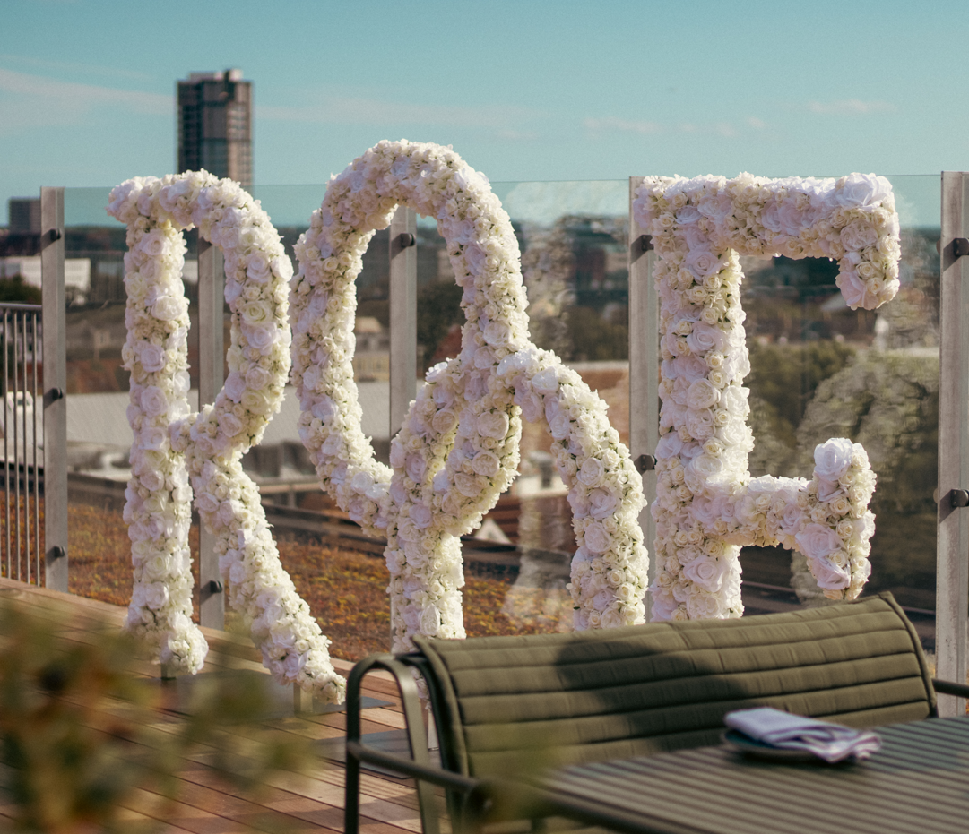 Close-up of three gourmet appetizers with cream, chives, and black caviar on toasted bread rounds.