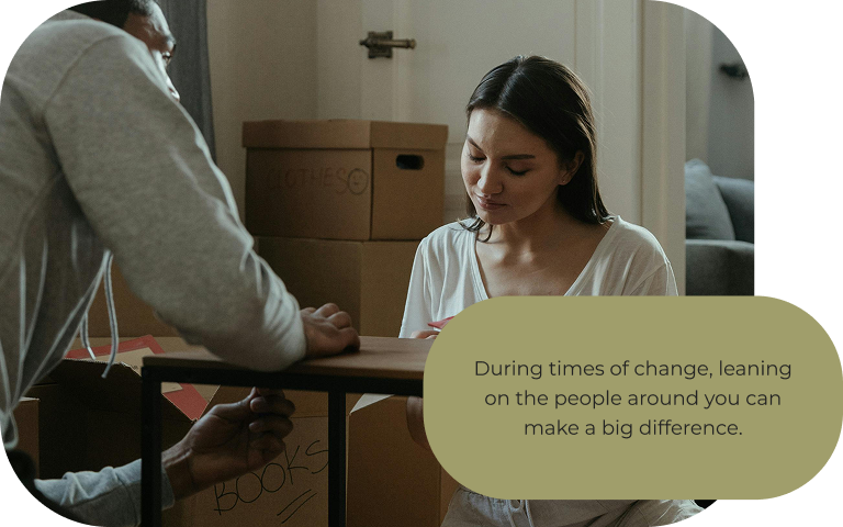 Image: Two people assembling a table together. Text: During times of change, leaning on the people around you can make a big difference.