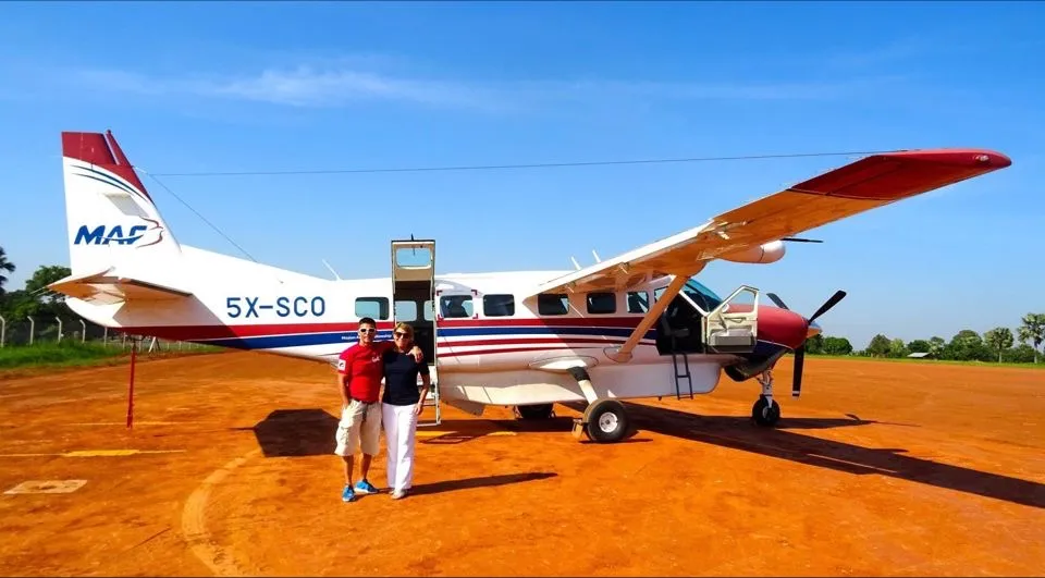 Rachel Gardner-Poole OBE in front of a MAF Cessna Grand Caravan