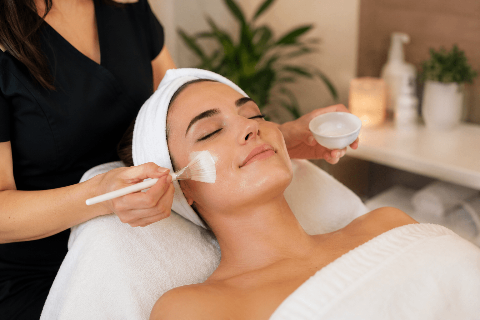 Esthetician giving a customized facial treatment at a skin clinic in Ocala, Florida
