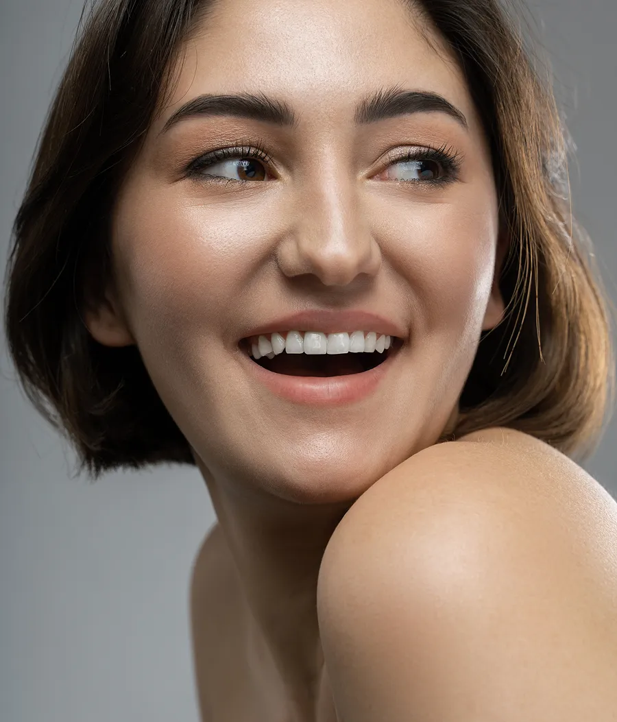A close up of a woman with a smile on her face.